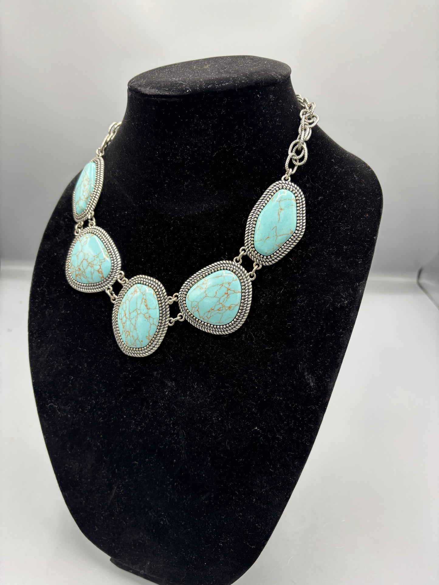 Blue five stone silver tone necklace