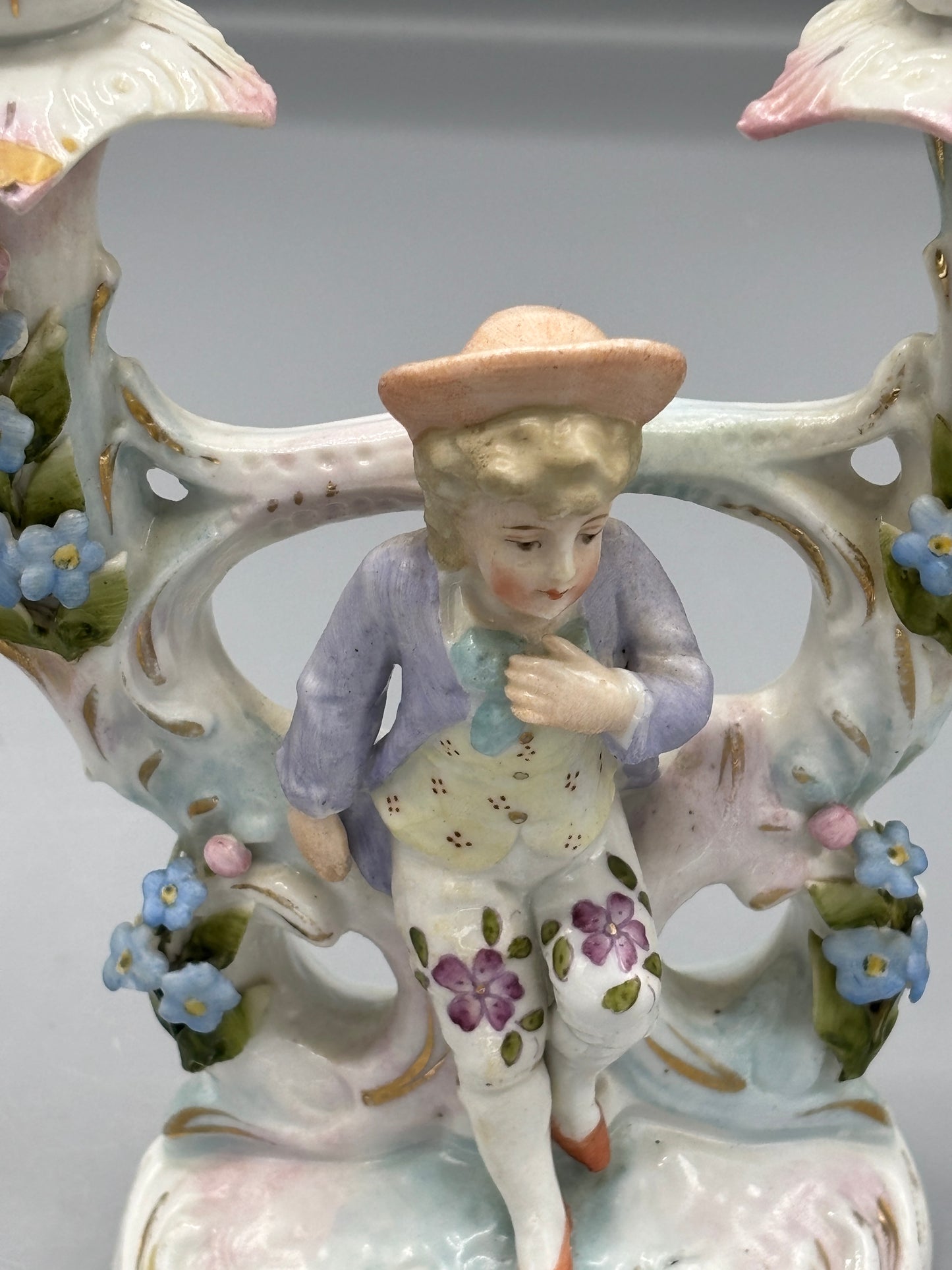Pair of girl & boy candelabra with ceramic candle