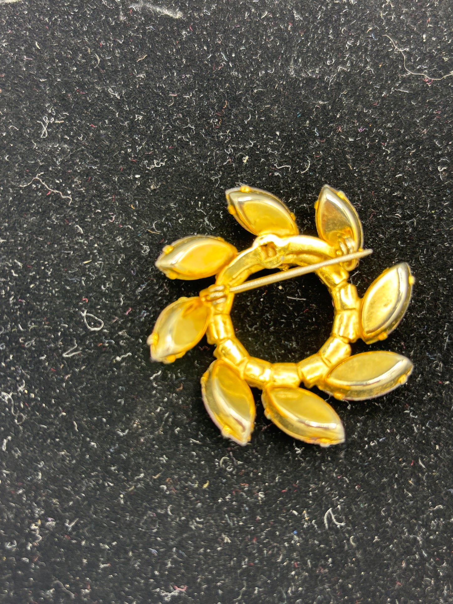 Vintage gold tone purple crystal circle brooch