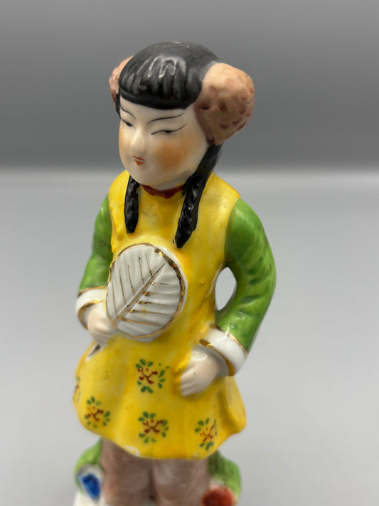 Vintage Japanese girl figure with braids