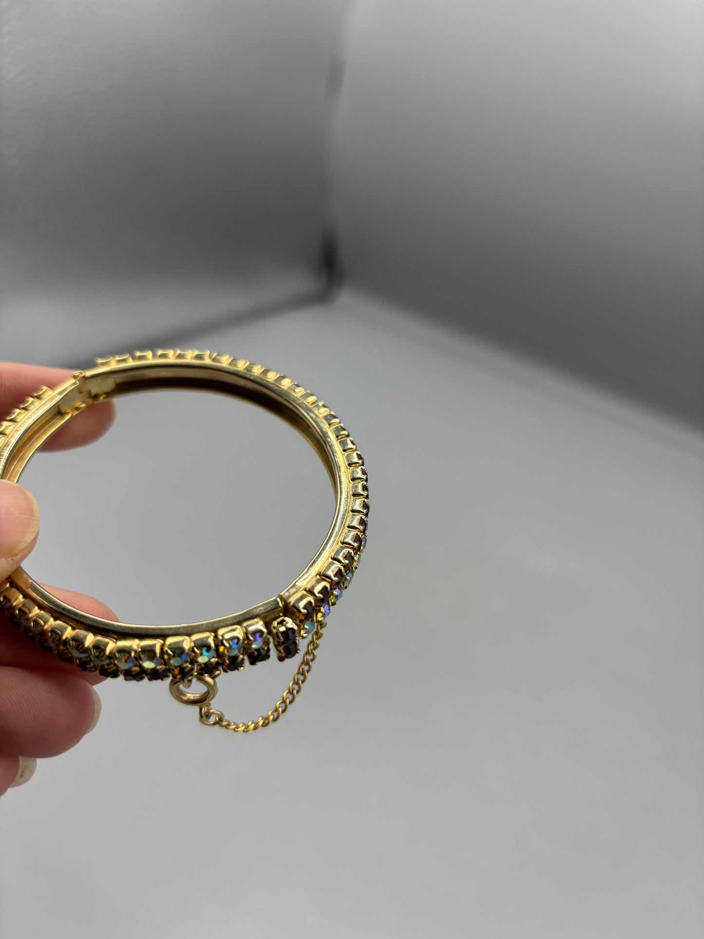 Gold tone bangle with 2 tone rhinestone
