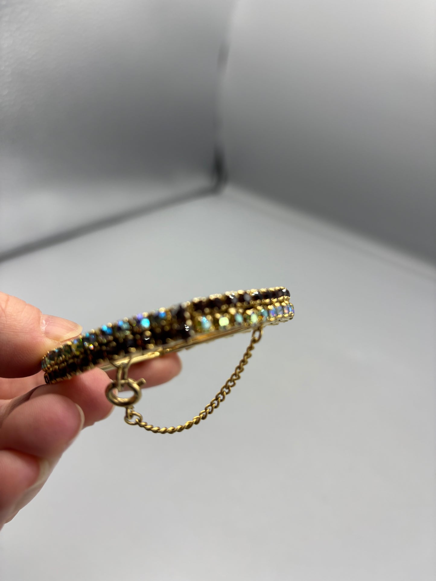 Gold tone bangle with 2 tone rhinestone