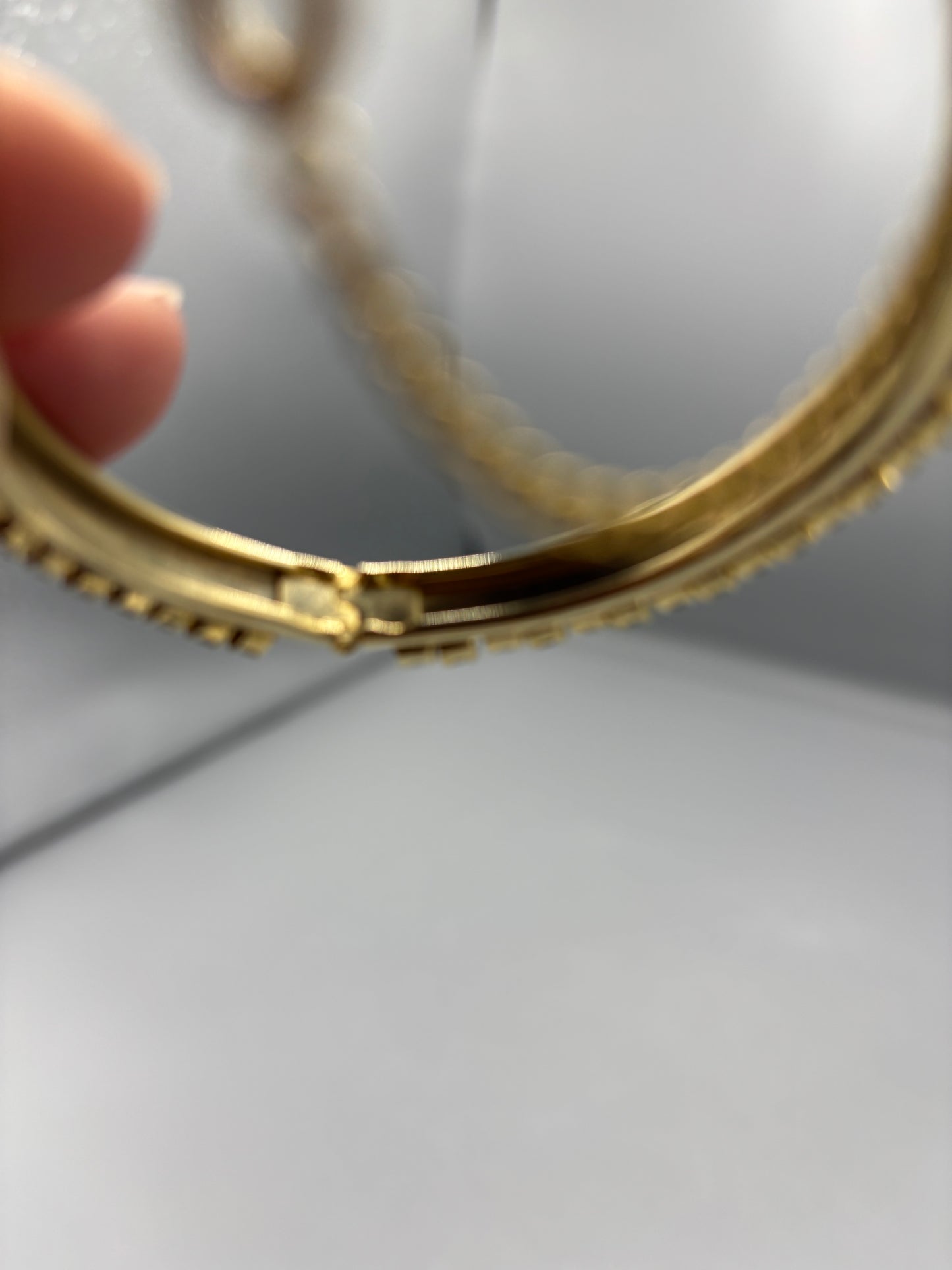 Gold tone bangle with 2 tone rhinestone