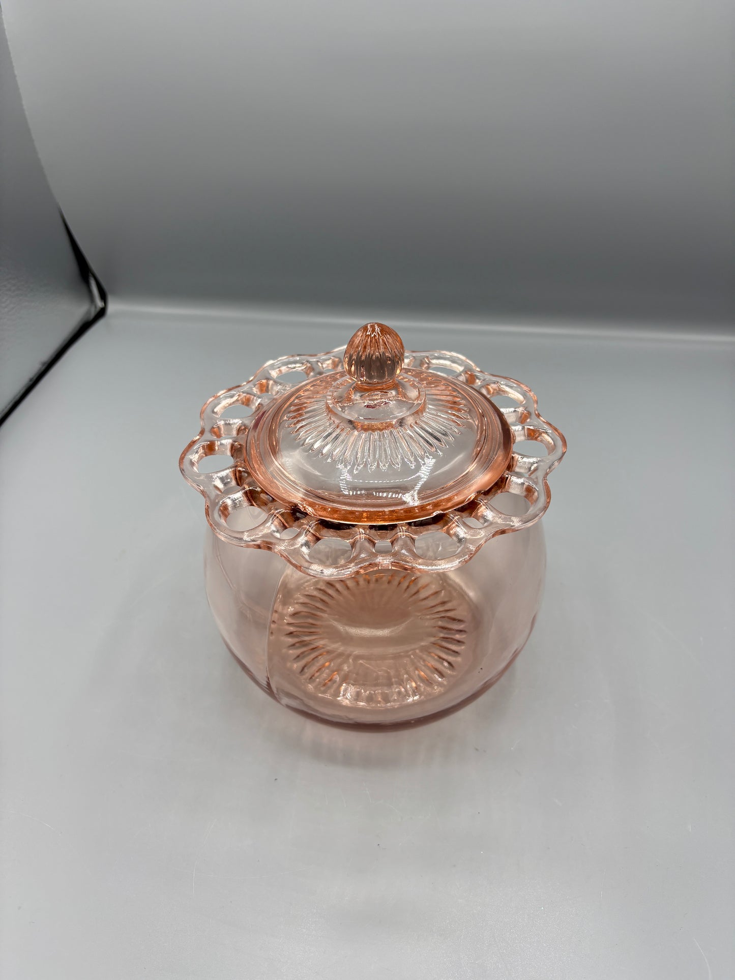 Vintage pink depression glass cookie jar with lid