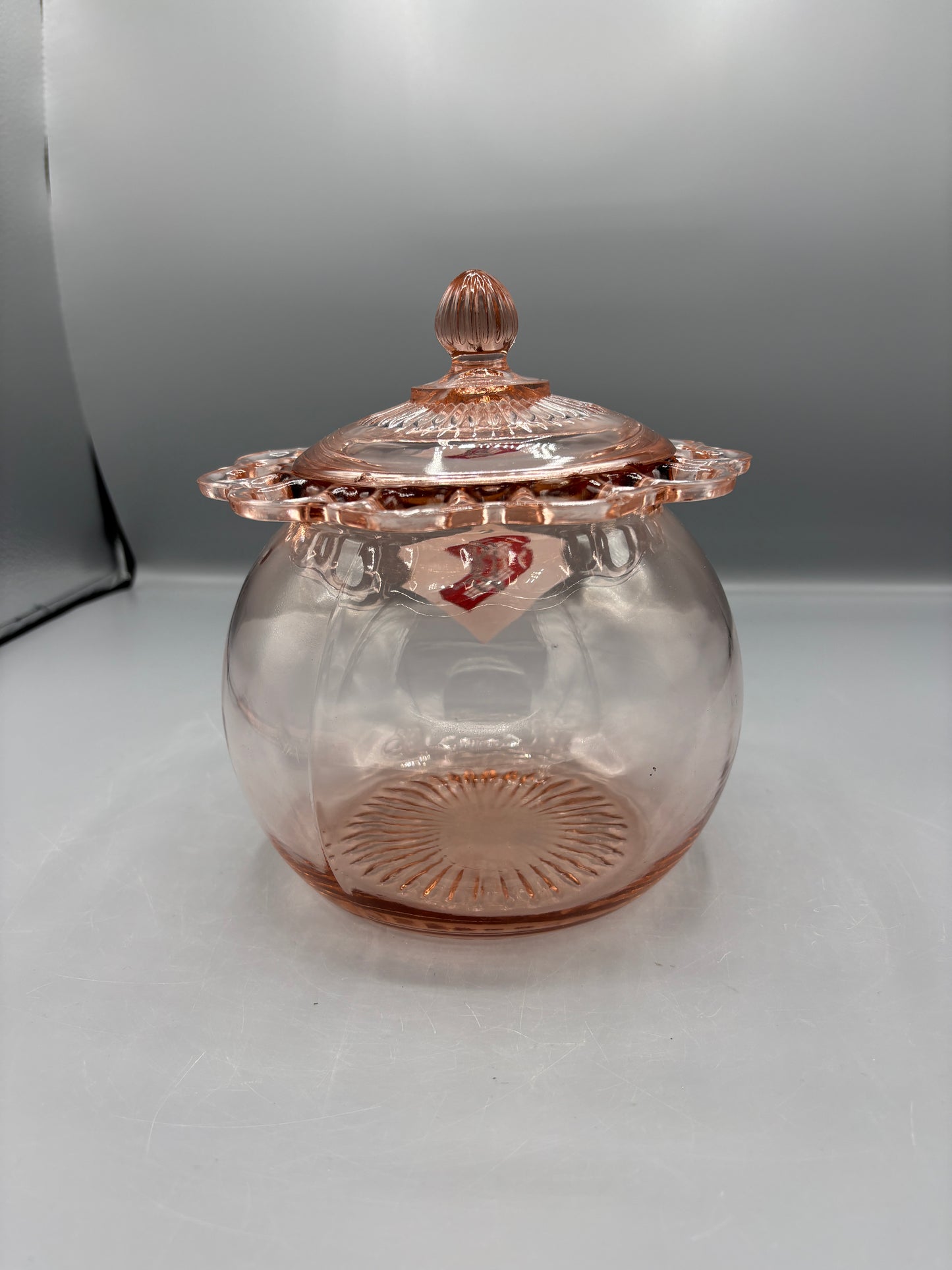 Vintage pink depression glass cookie jar with lid