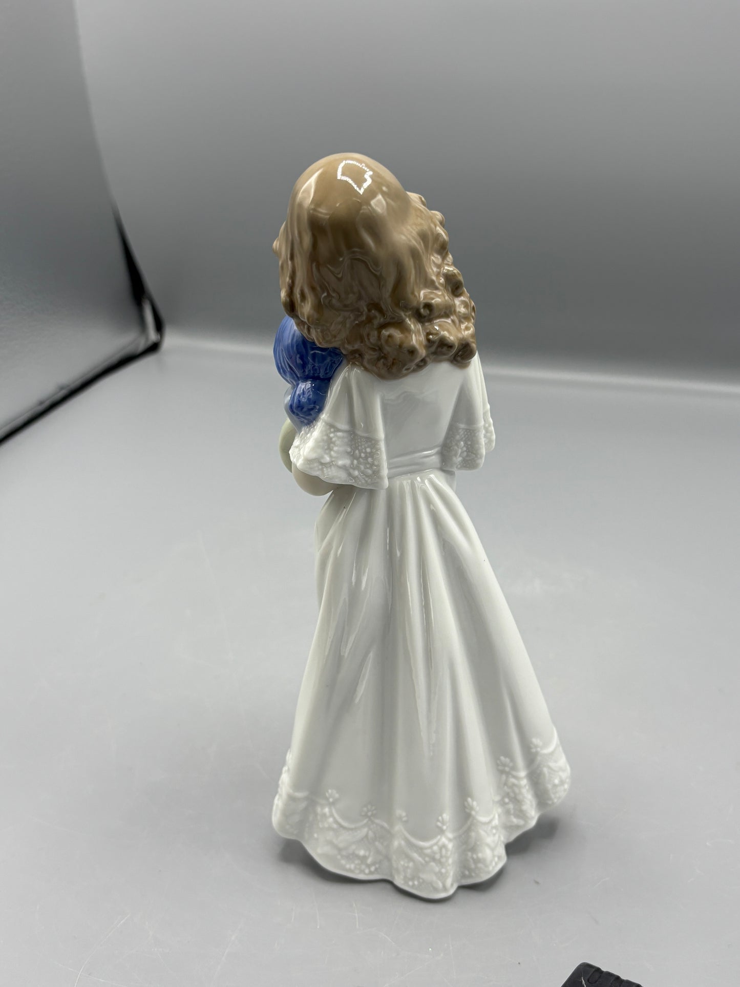 Nao by Lladro girl with doll "We're sleepy"