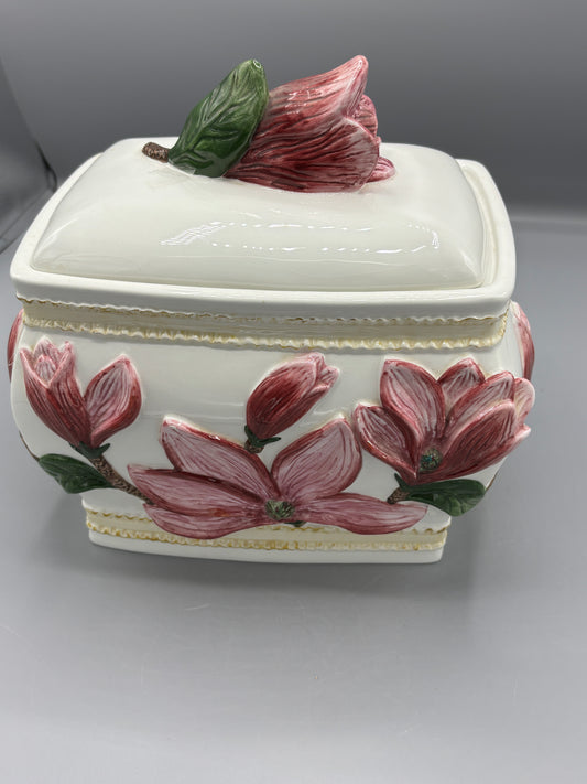 Ceramic lidded jar with applied pink magnolia blossom