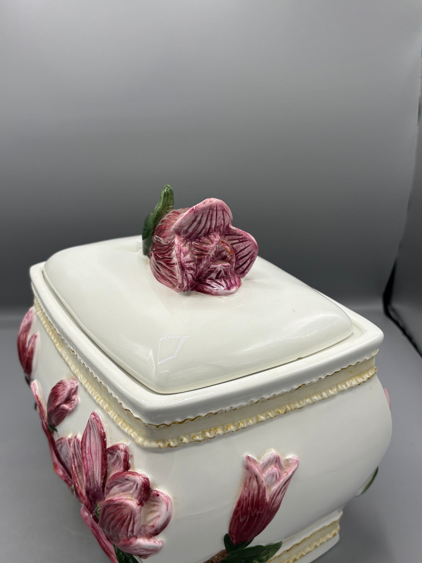 Ceramic lidded jar with applied pink magnolia blossom
