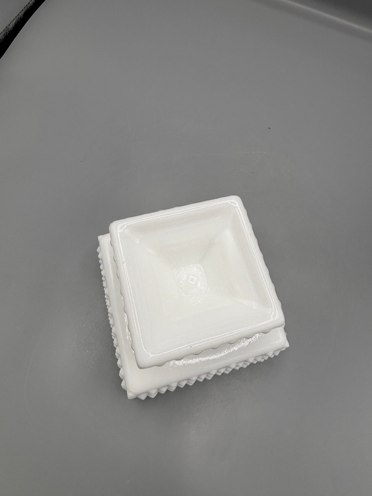 Fenton hobnail milk glass lidded square footed jar