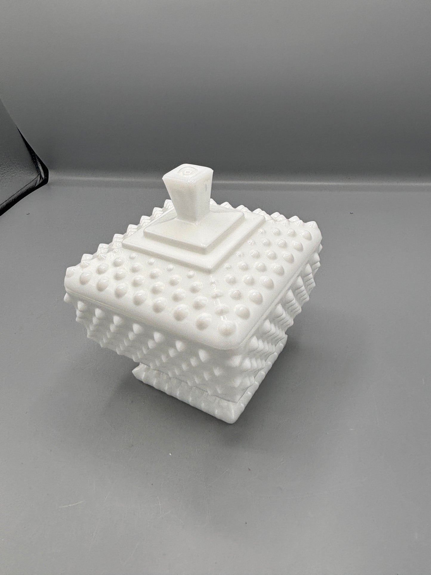 Fenton hobnail milk glass lidded square footed jar