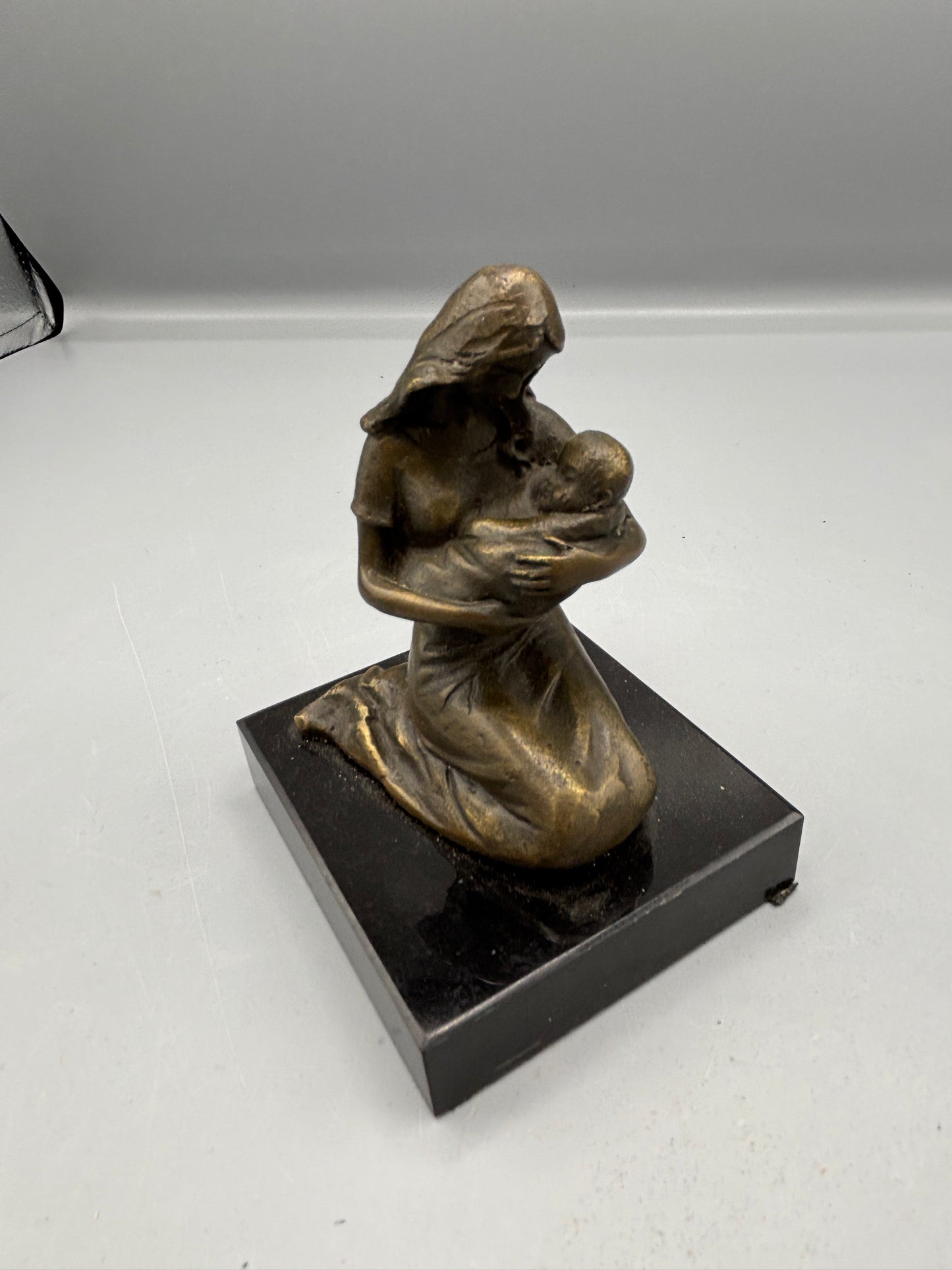 Vintage Bronze "Milo" Mothers embrace on black marble