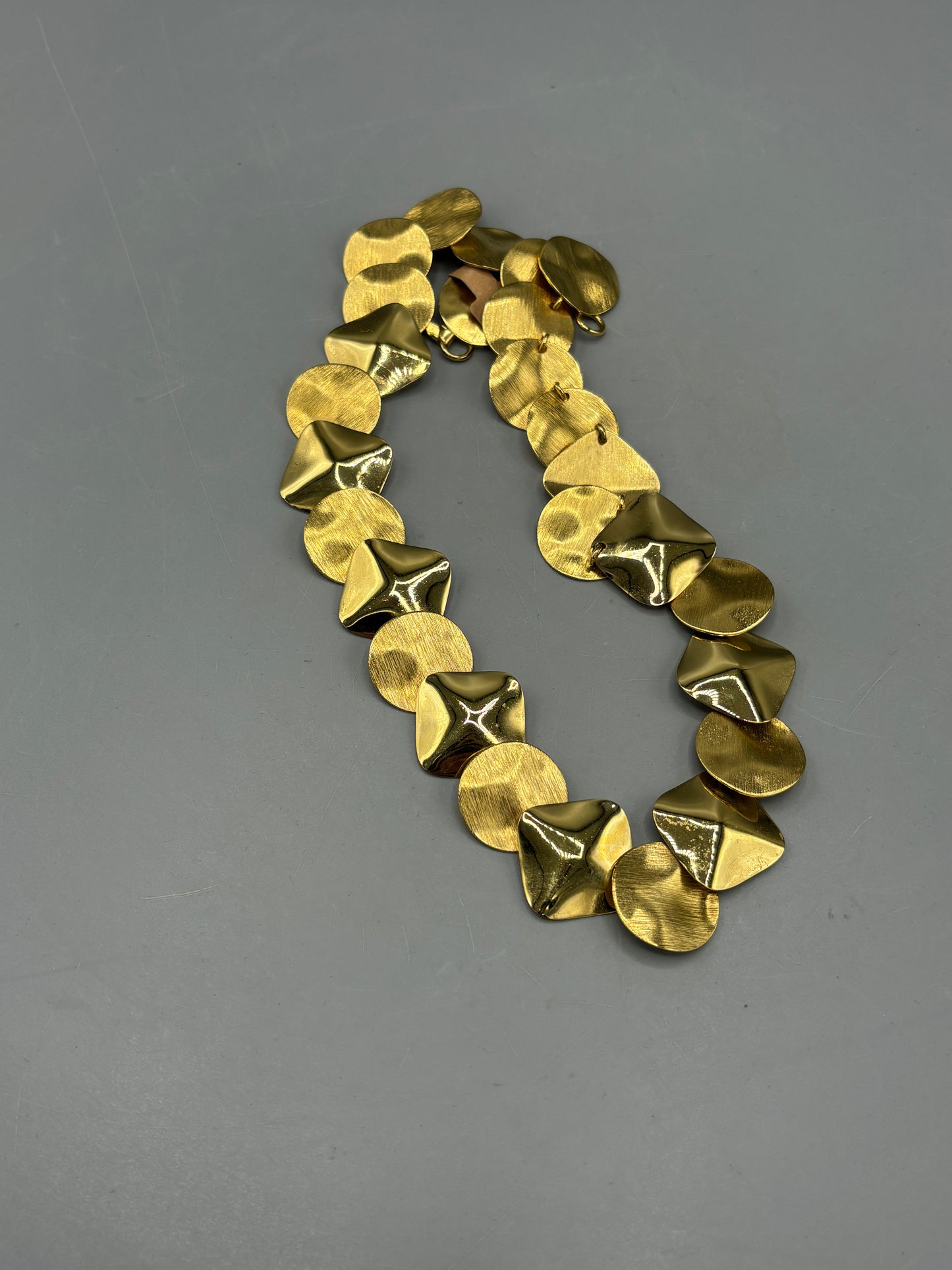 Gold tone disc necklace