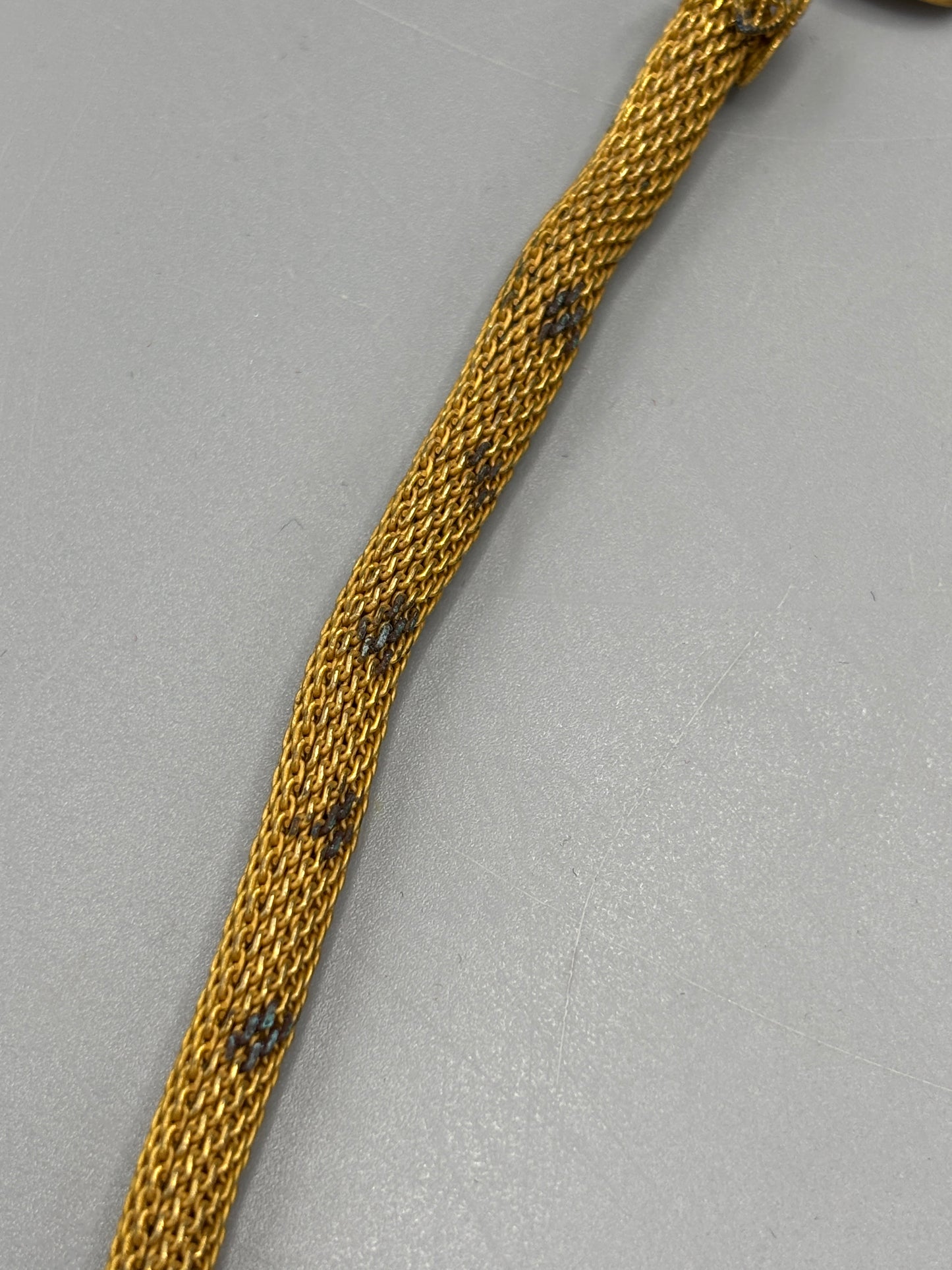 Miriam Haskell gold tone mesh with blue stone
