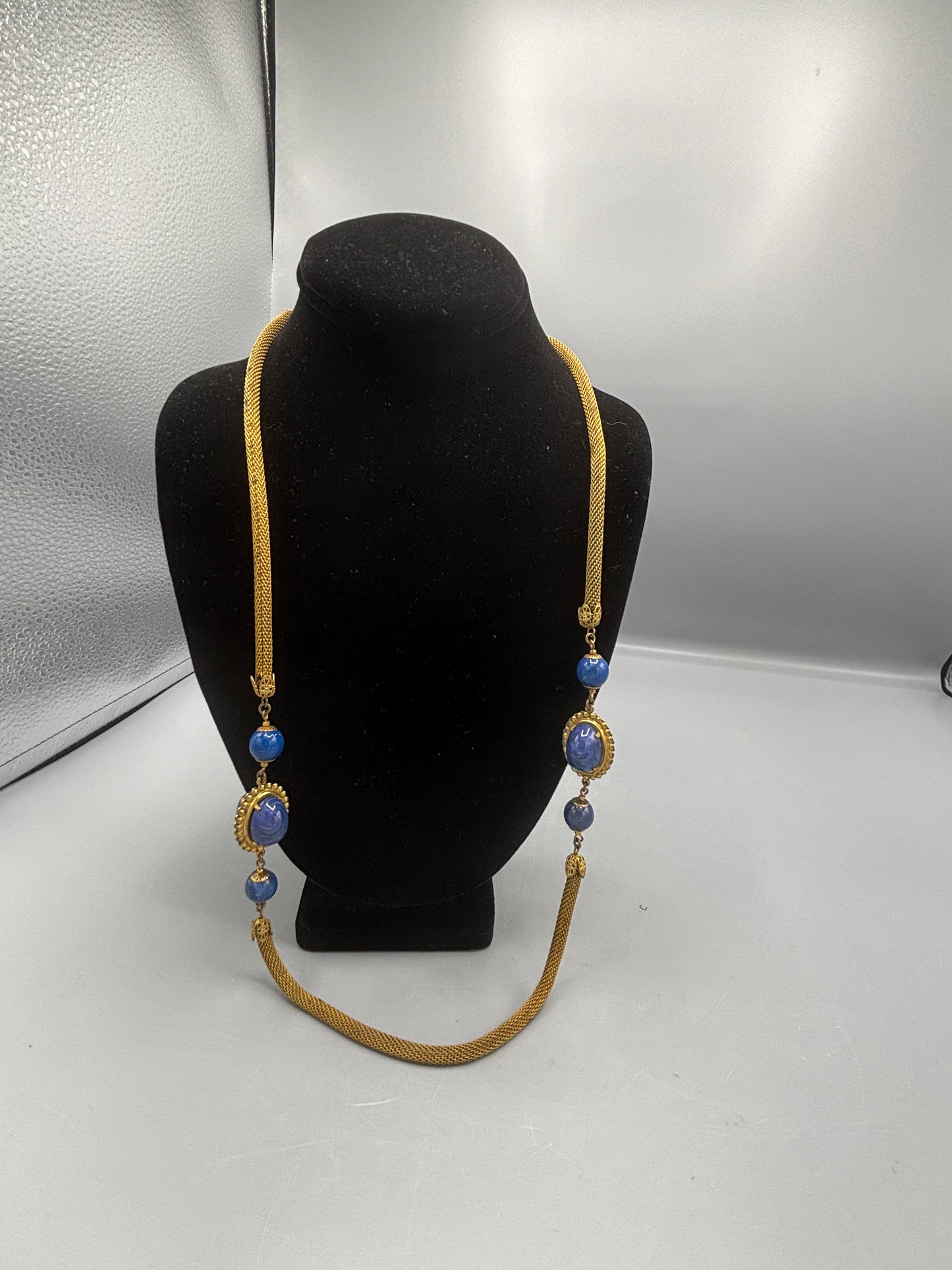 Miriam Haskell gold tone mesh with blue stone