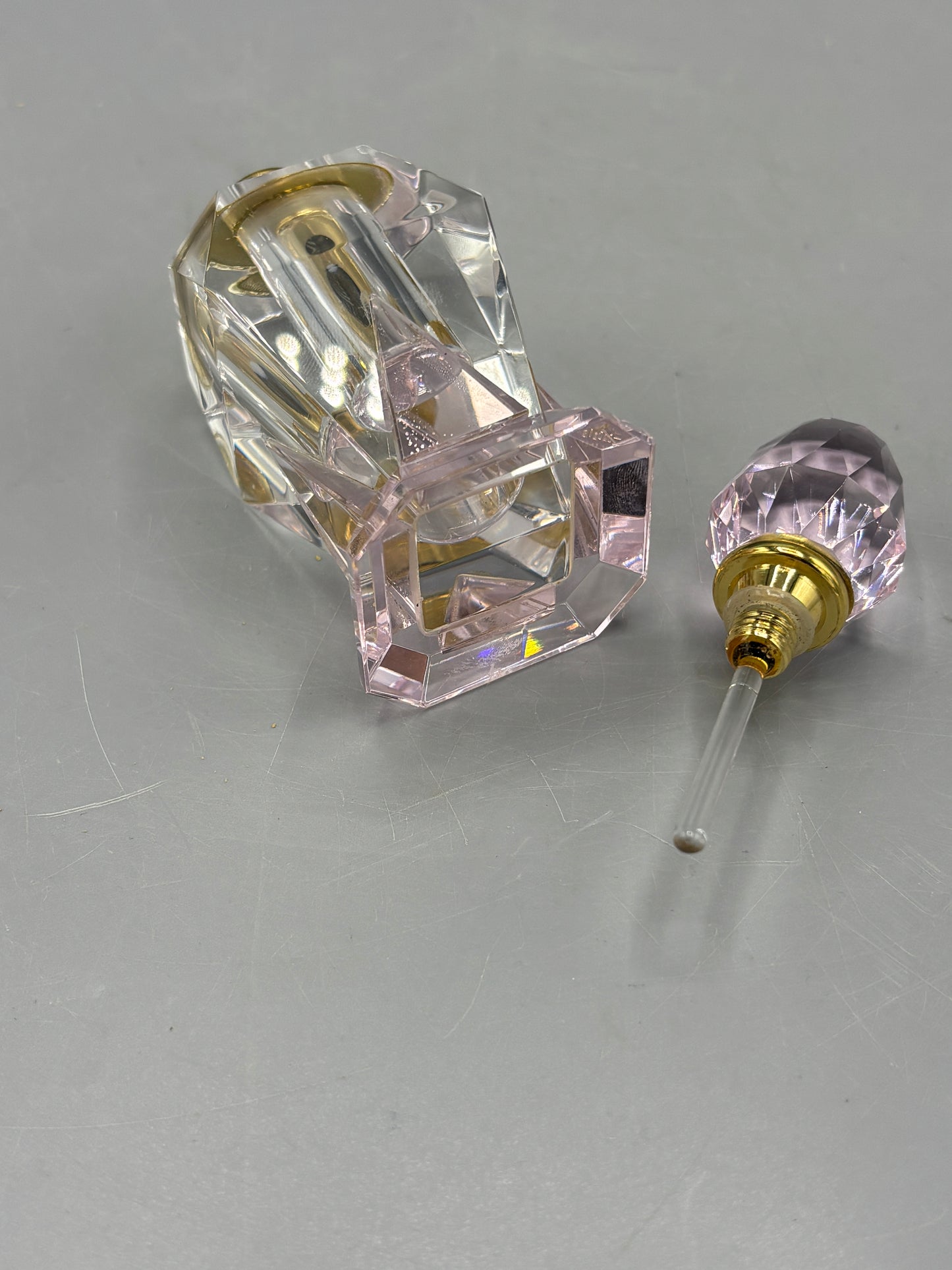 Pale pink crystal perfume bottle