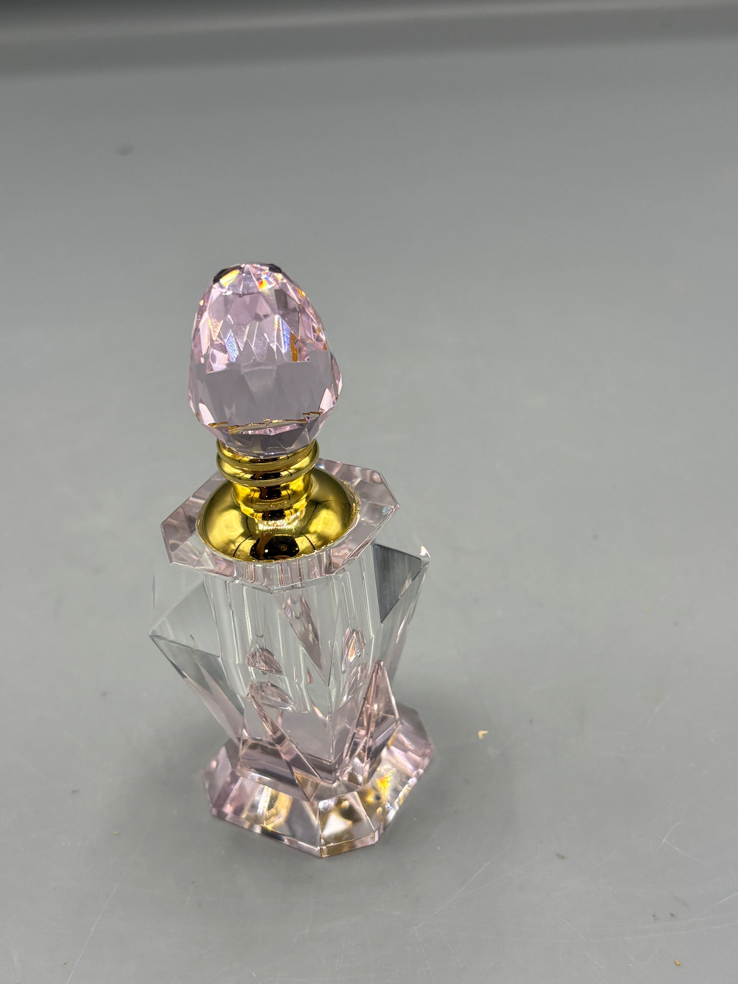 Pale pink crystal perfume bottle