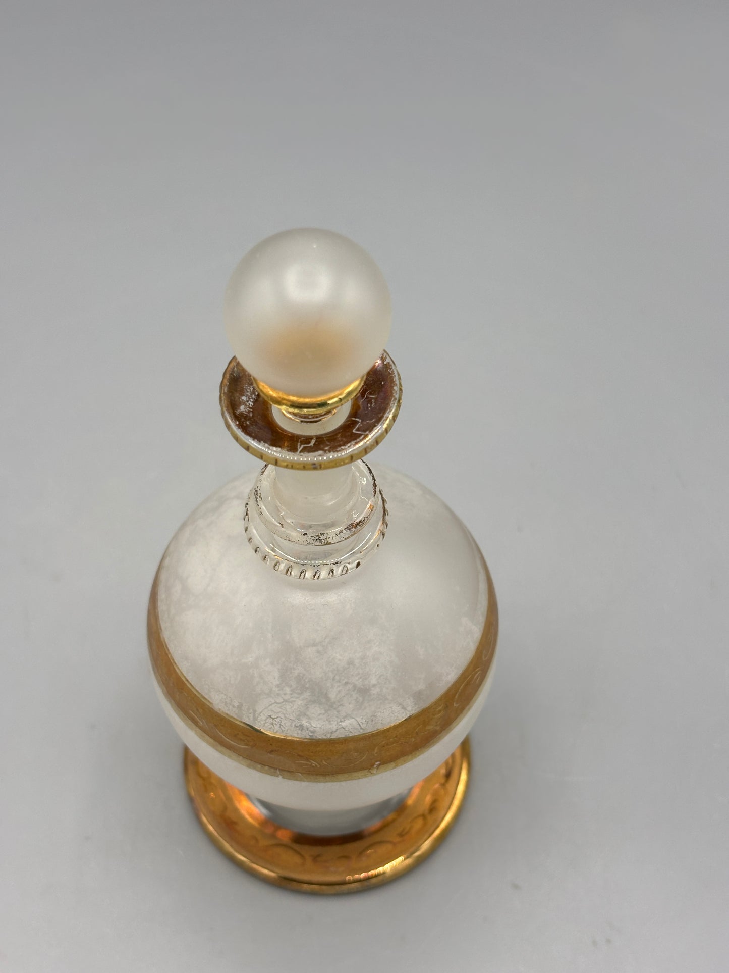 Antique perfume bottle with gold trim