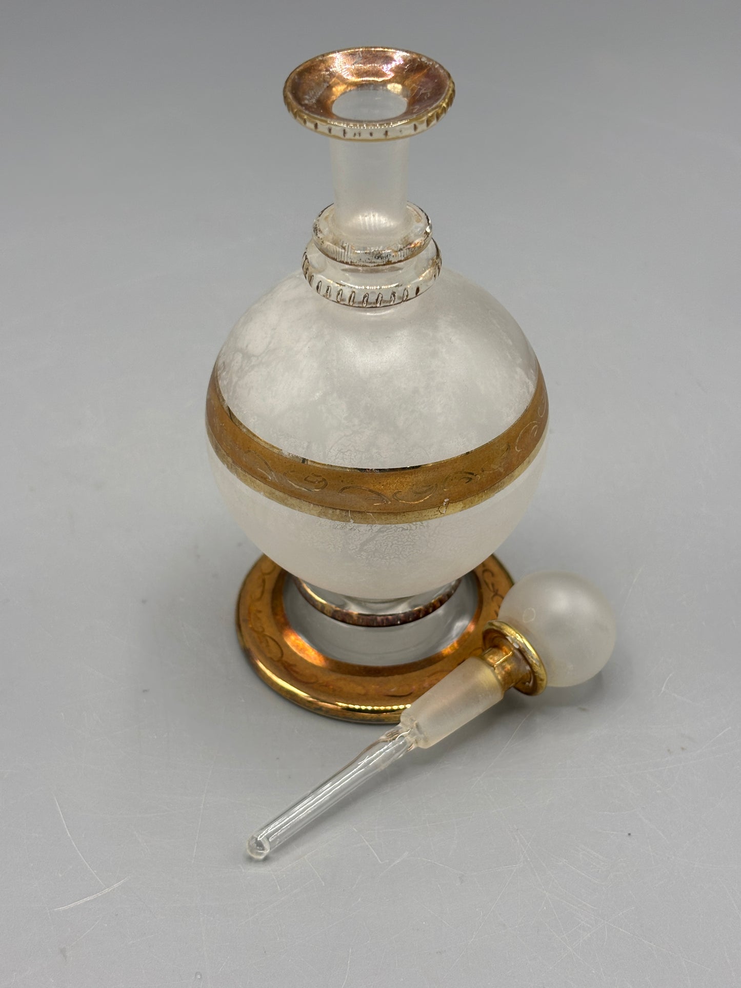 Antique perfume bottle with gold trim