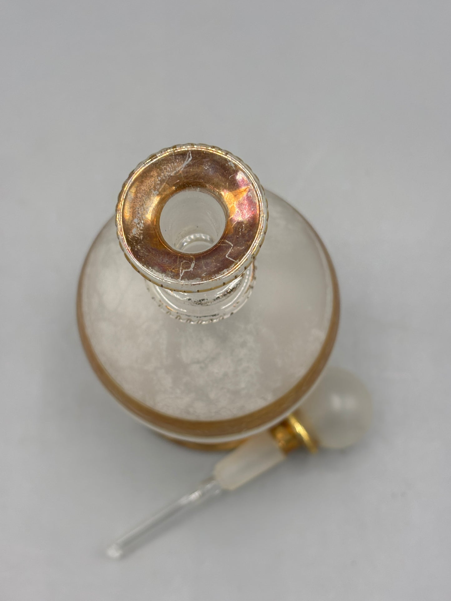 Antique perfume bottle with gold trim