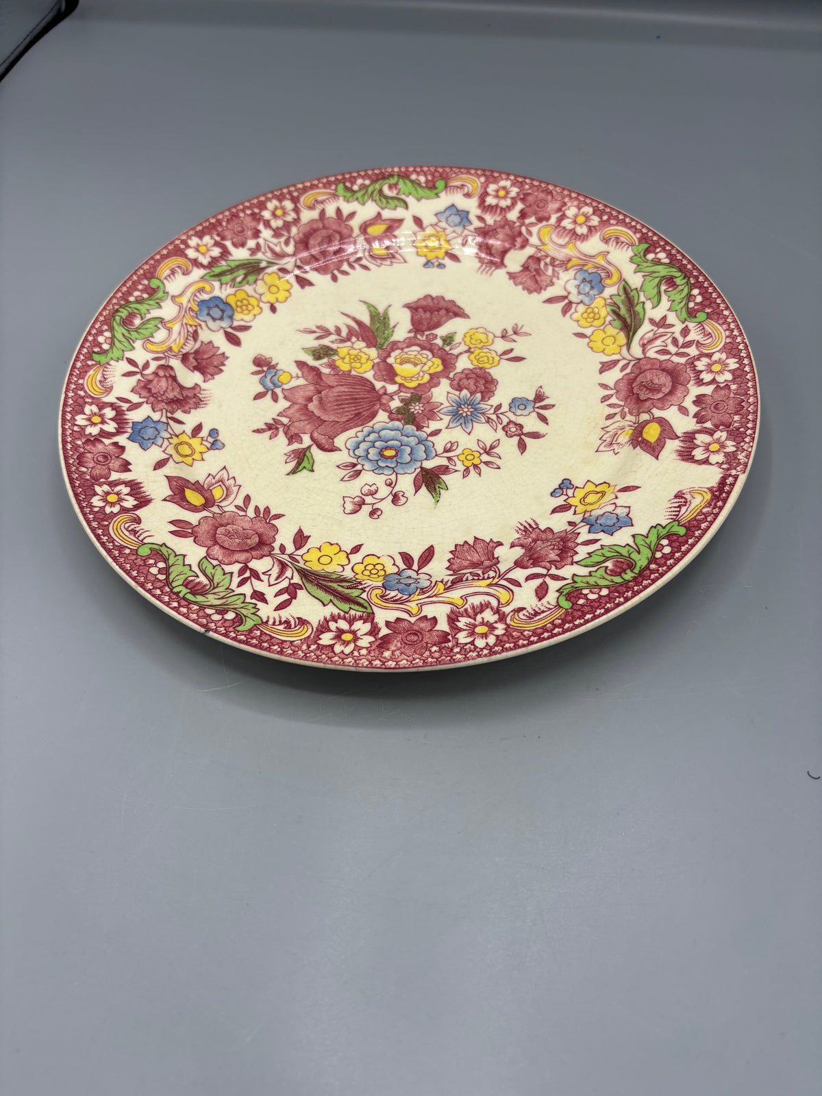 Vintage ceramic plate with pink design