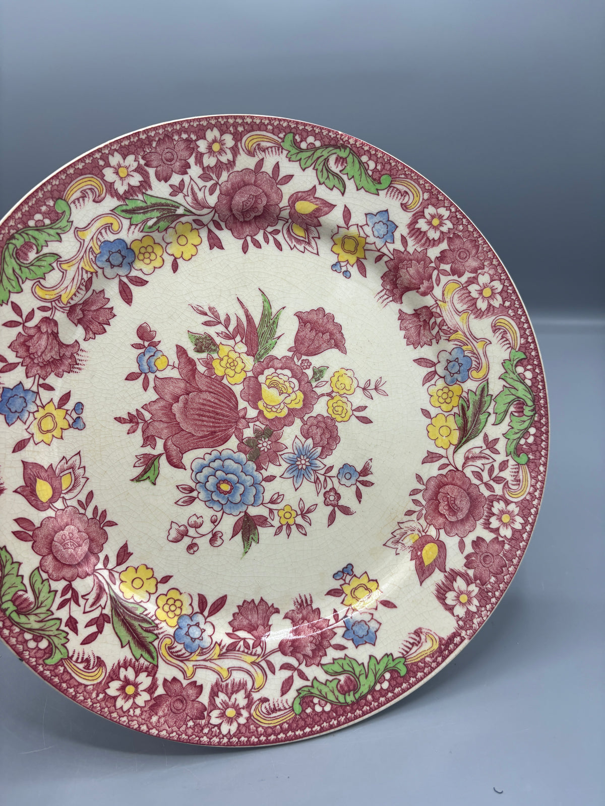 Vintage ceramic plate with pink design