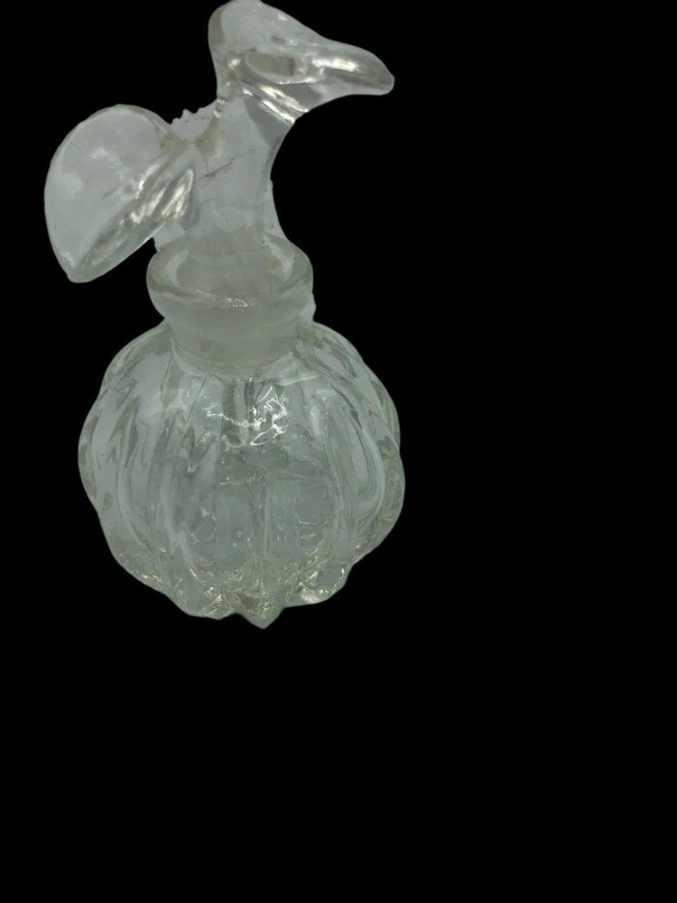 Glass perfume bottle with flower stopper