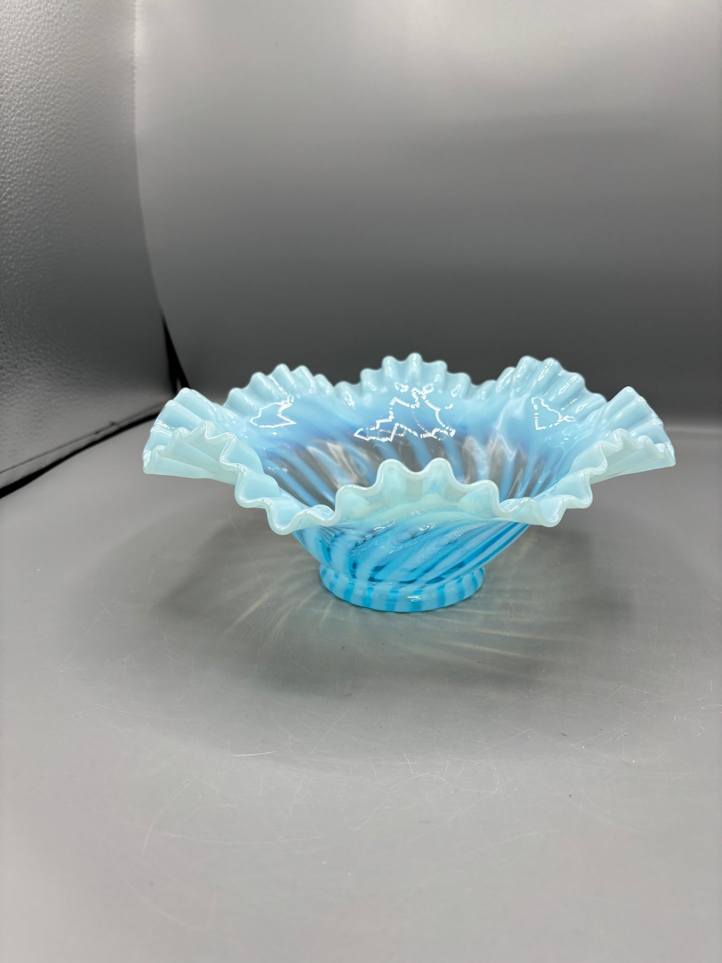 Vintage Fenton blue opalescent spiral optic bowl