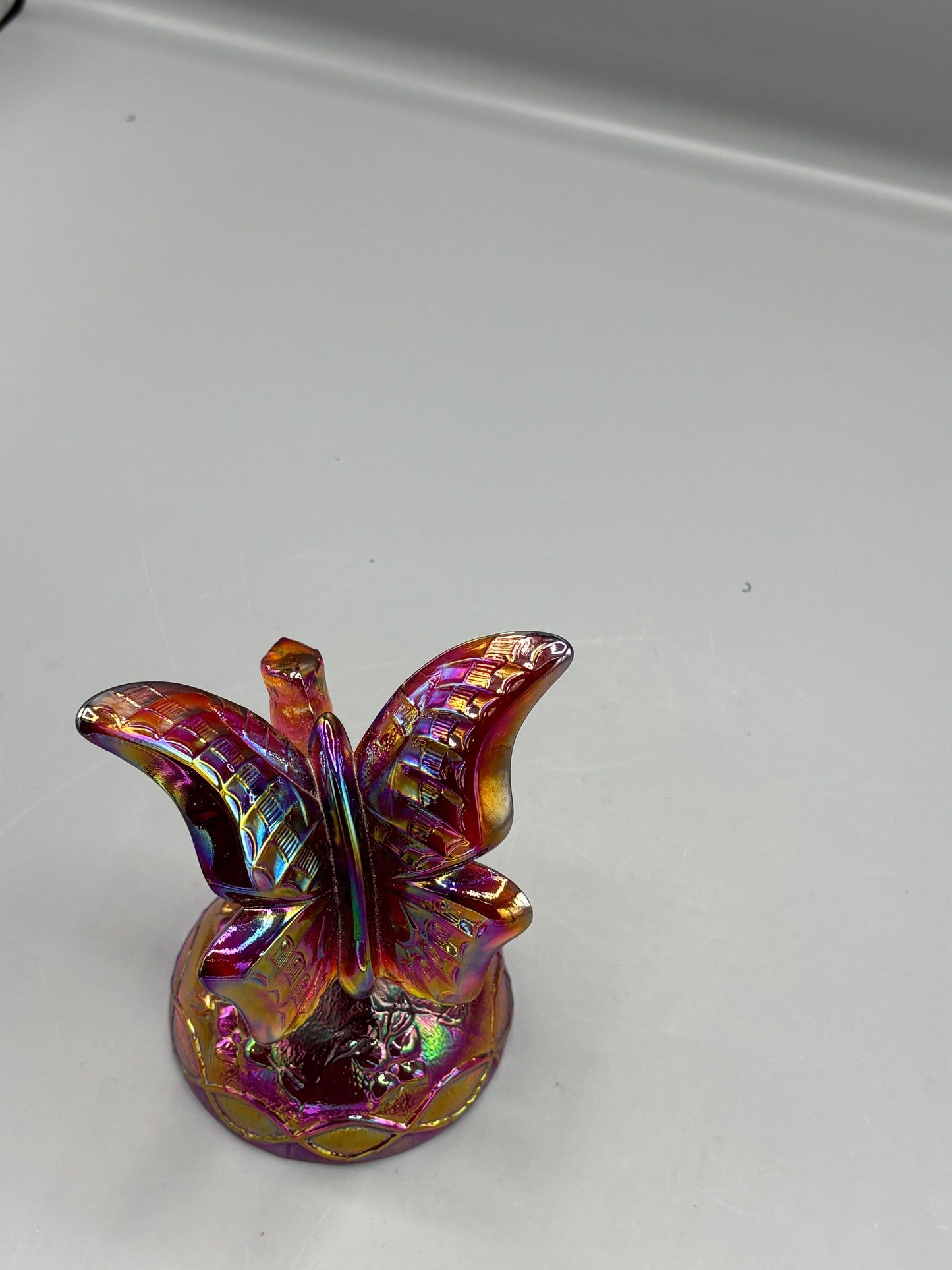 Vintage Fenton Ruby butterfly in a branch ring holder