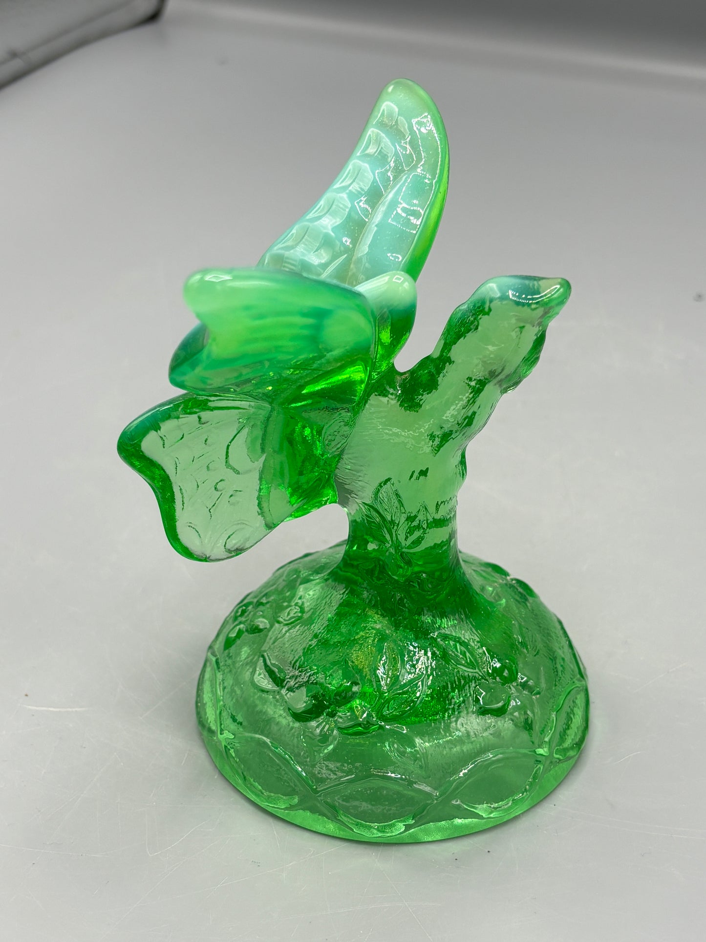 Vintage Fenton Uranium butterfly in a branch ring holder