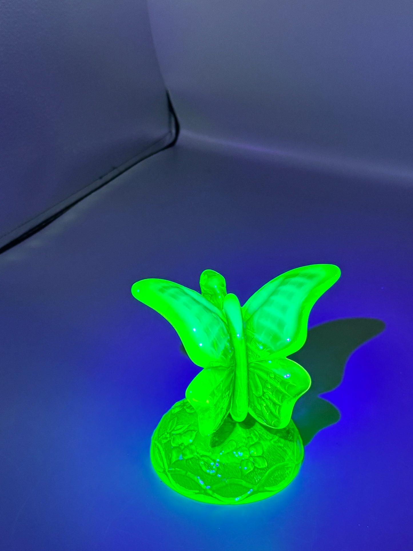 Vintage Fenton Uranium butterfly in a branch ring holder