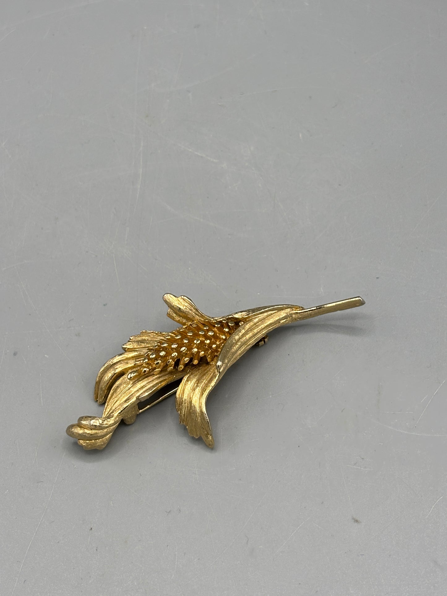 Vintage gold tone floral design
