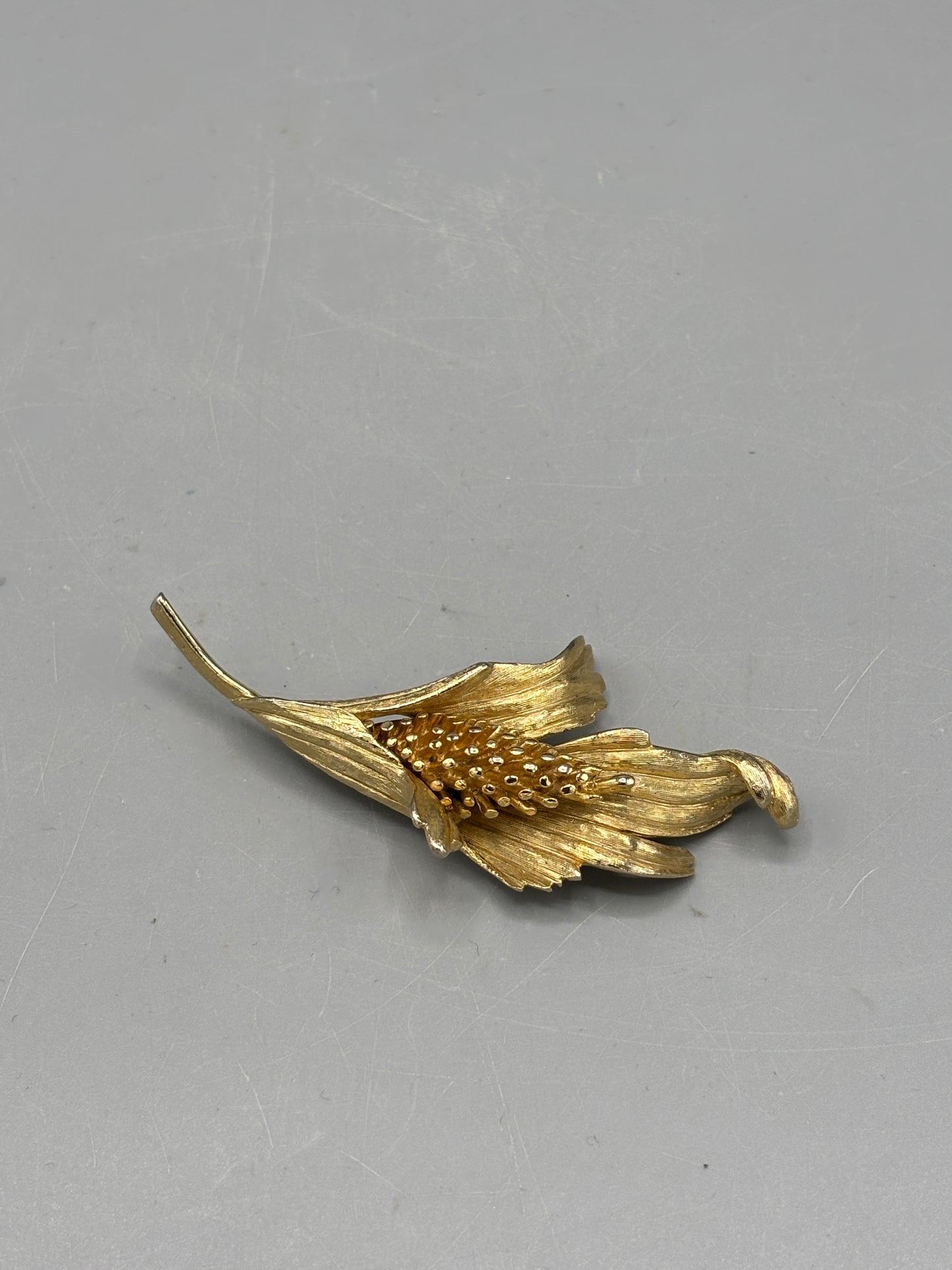 Vintage gold tone floral design