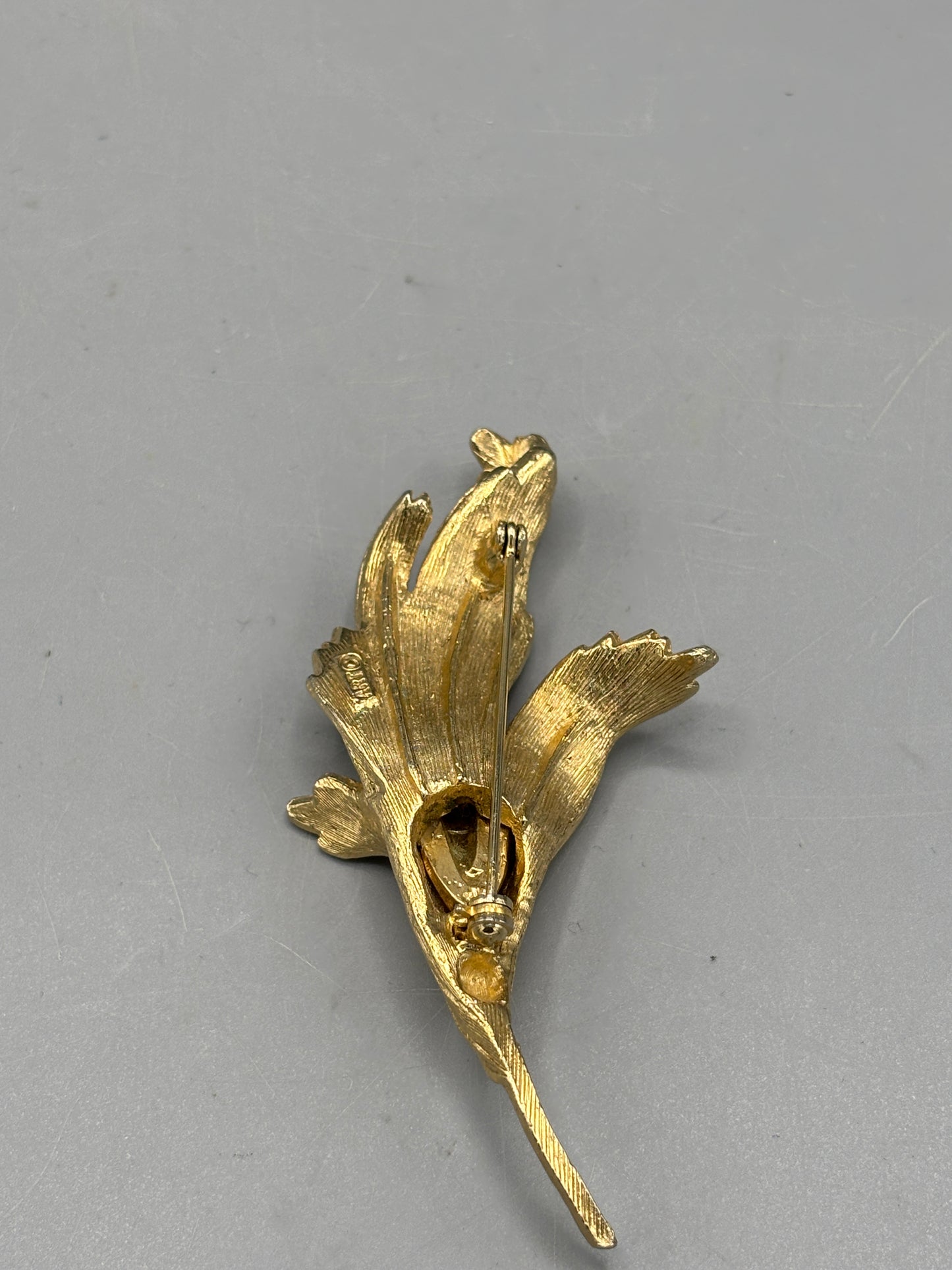 Vintage gold tone floral design