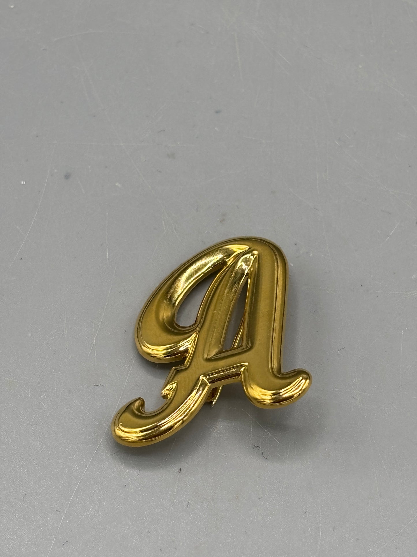 Vintage gold tone A initial brooch