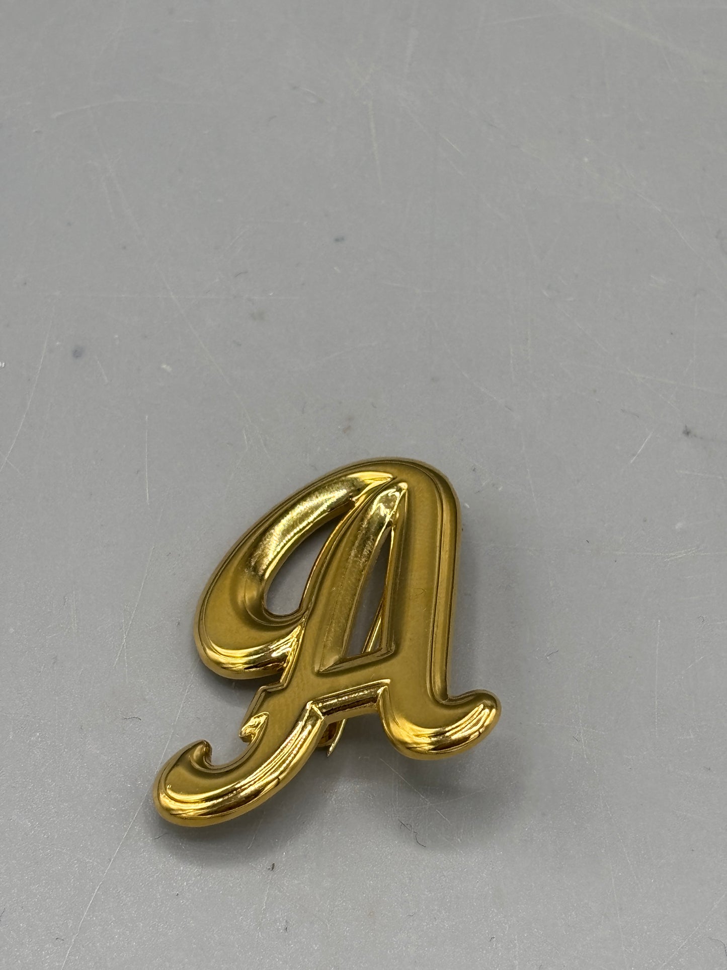 Vintage gold tone A initial brooch