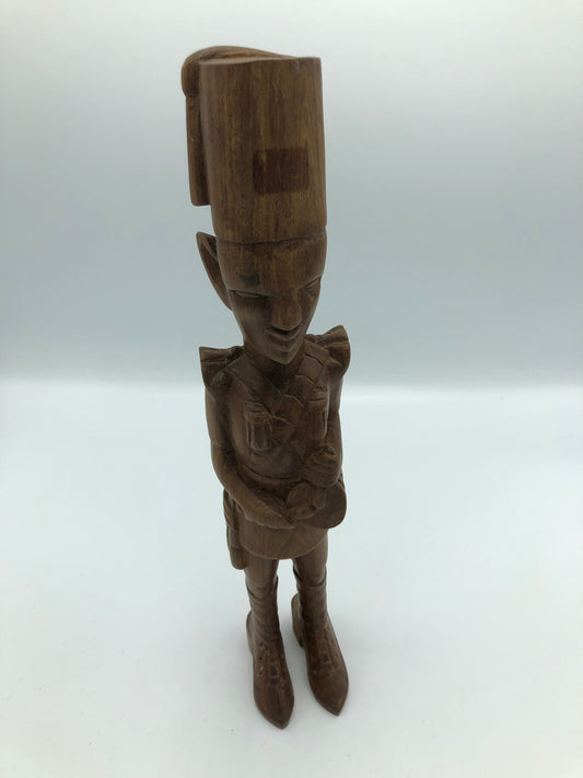 Wood hand carved man playing drum