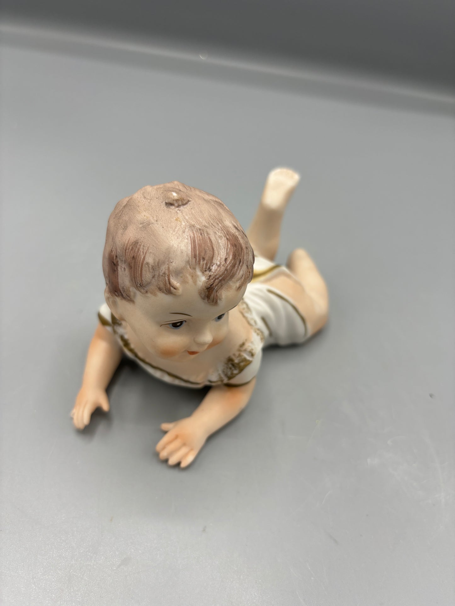 Rare  Vintage Porcelain baby laying down