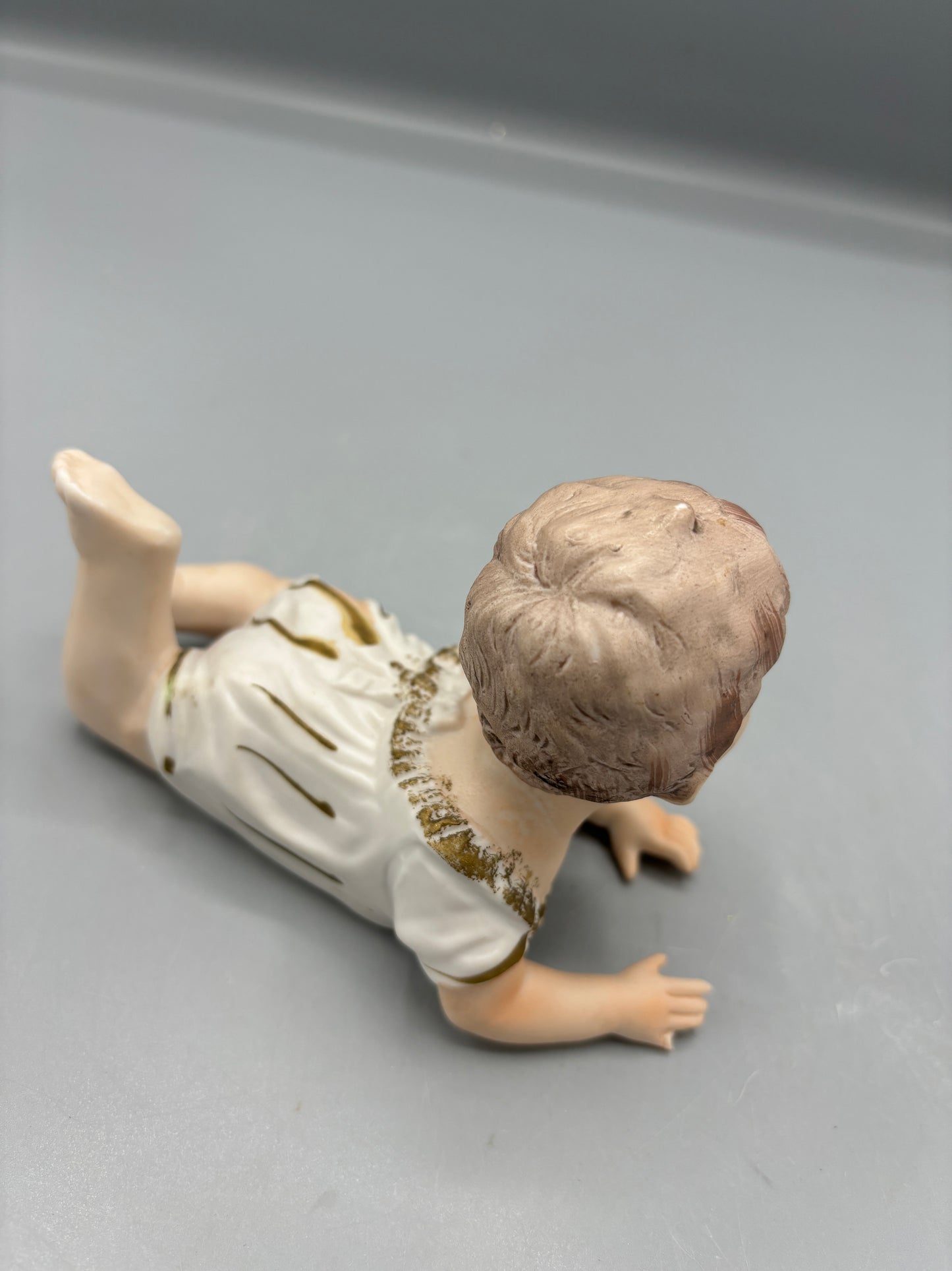 Rare  Vintage Porcelain baby laying down