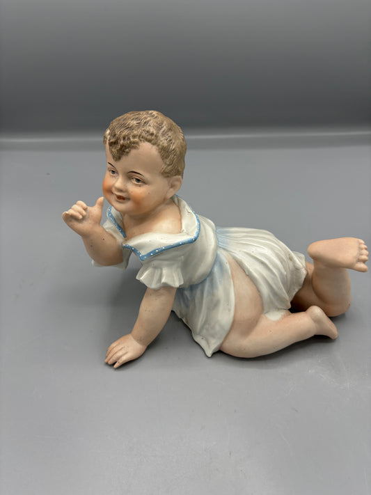 Large porcelain Bisque Piano baby boy crawling