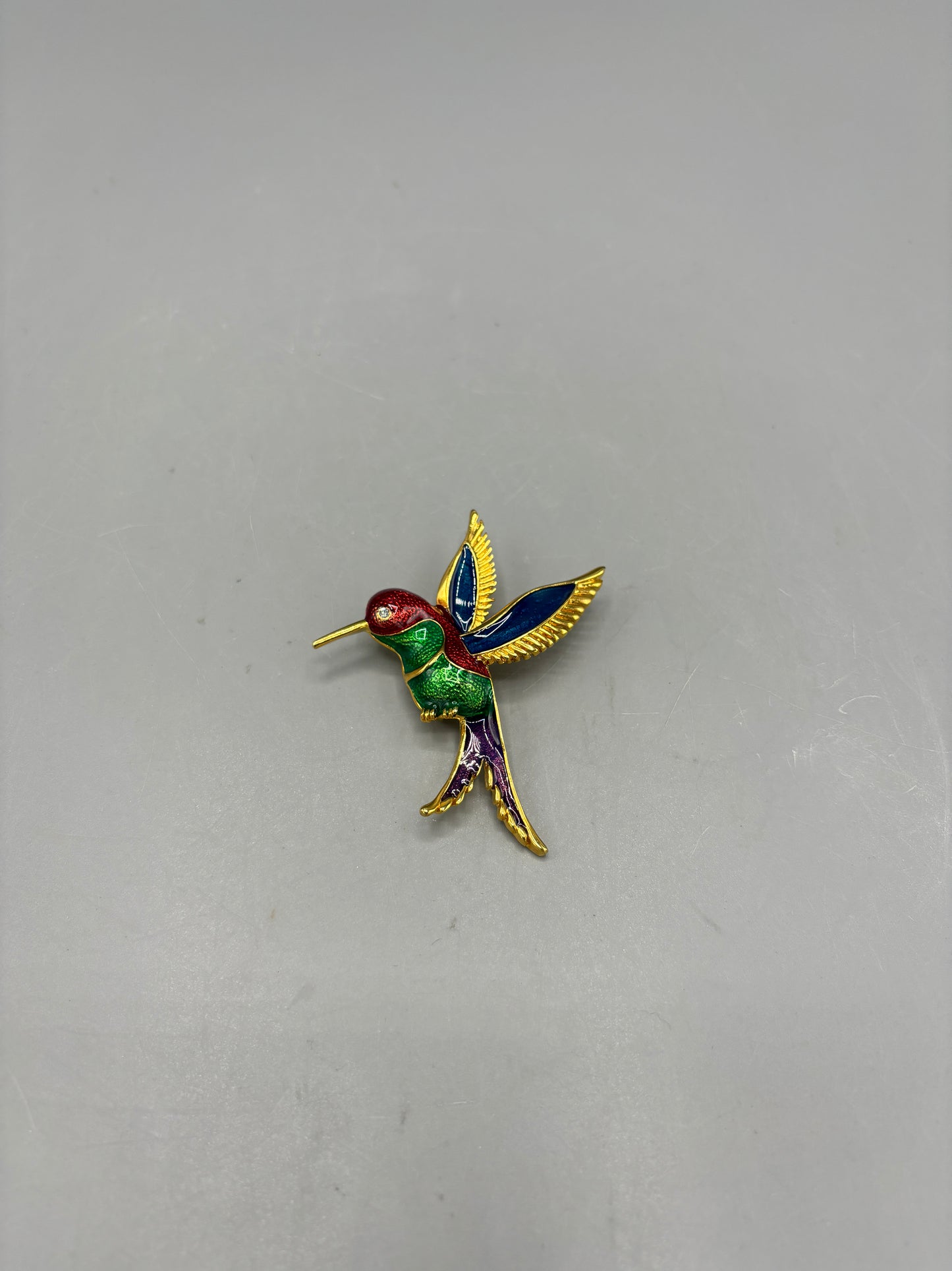 Gold tone colorful enamel hummingbird brooch