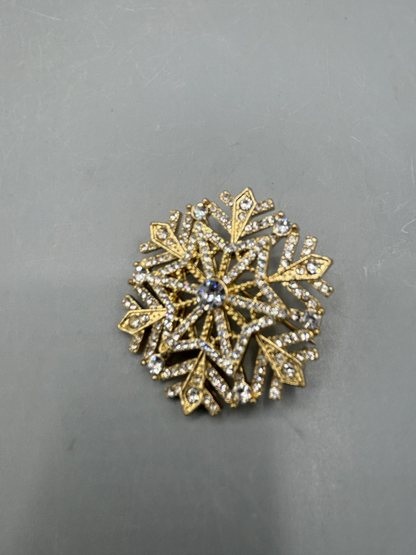 Gold tone Rhinestone snowflake brooch