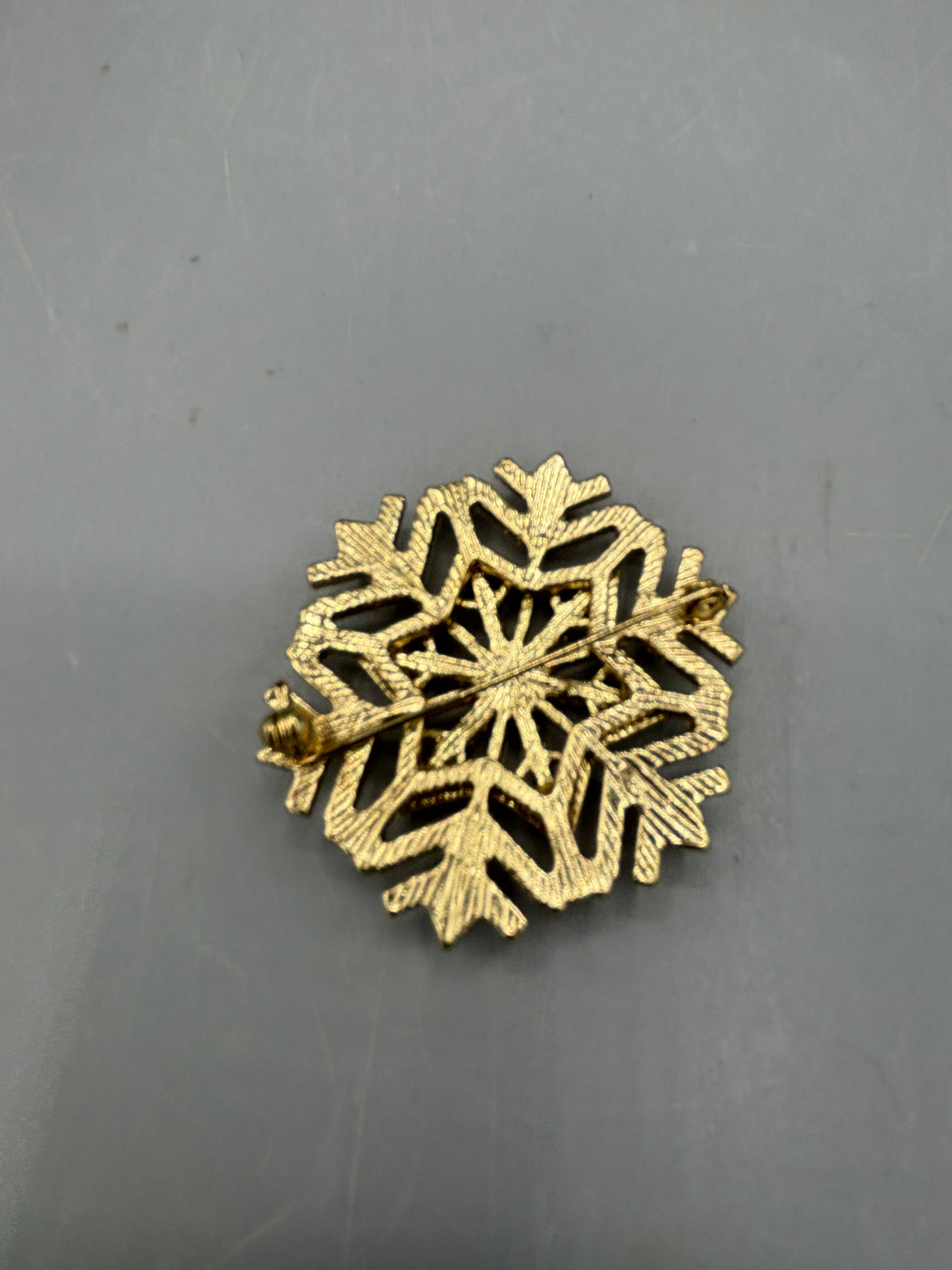 Gold tone Rhinestone snowflake brooch