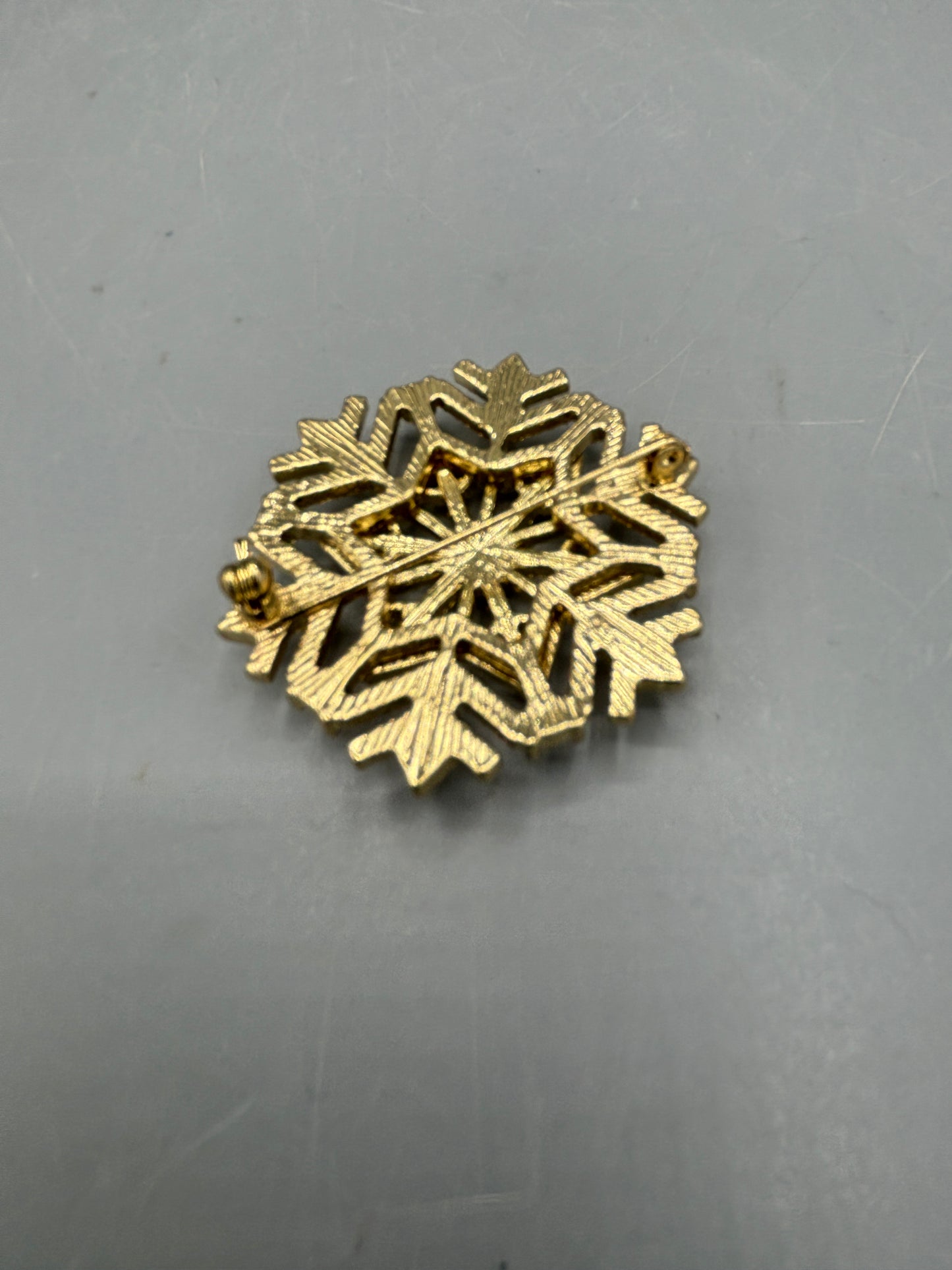 Gold tone Rhinestone snowflake brooch