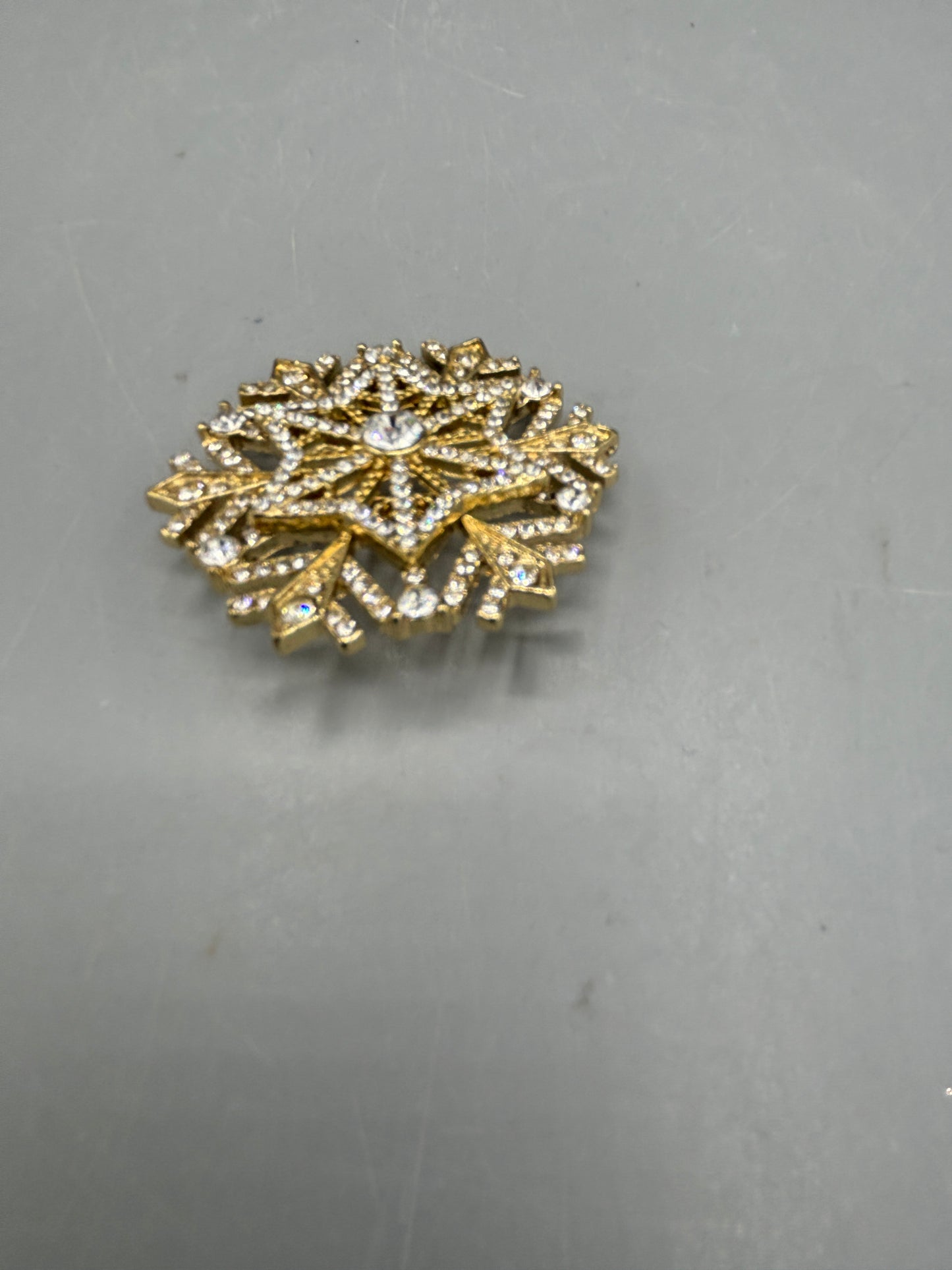 Gold tone Rhinestone snowflake brooch