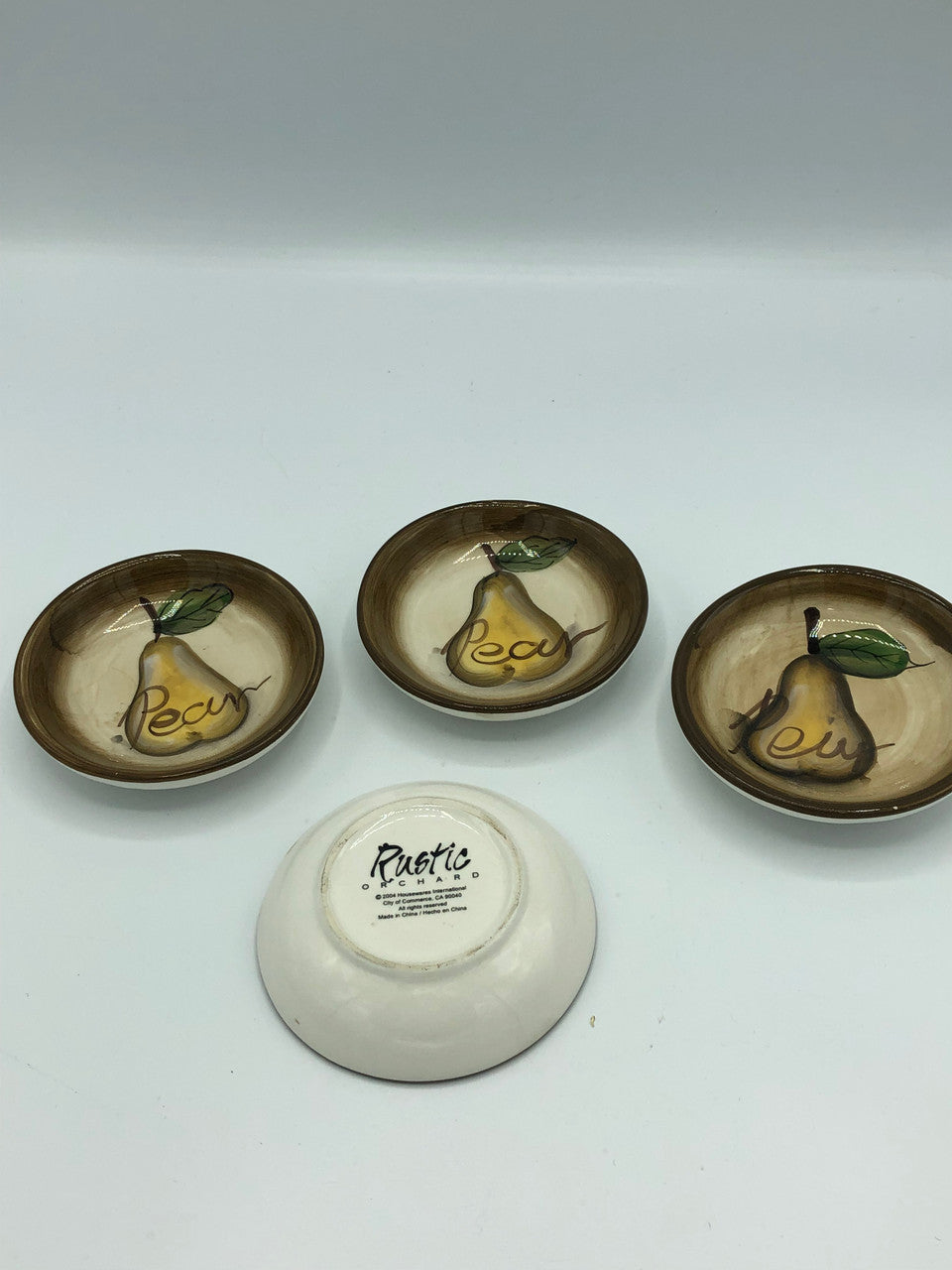 4 Ceramic oil dishes with pears