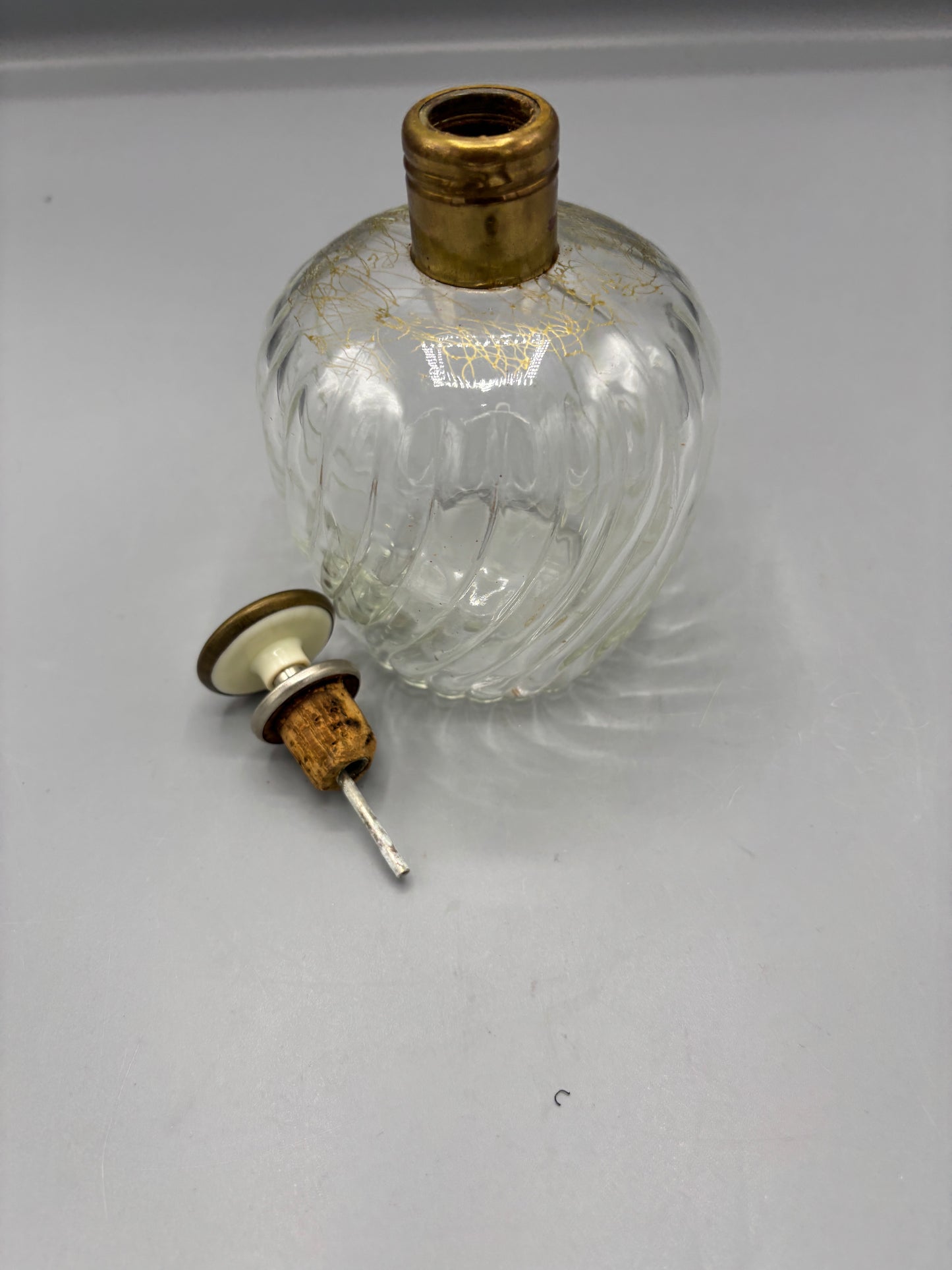 Vintage clear swirl glass decanter with gold stopper