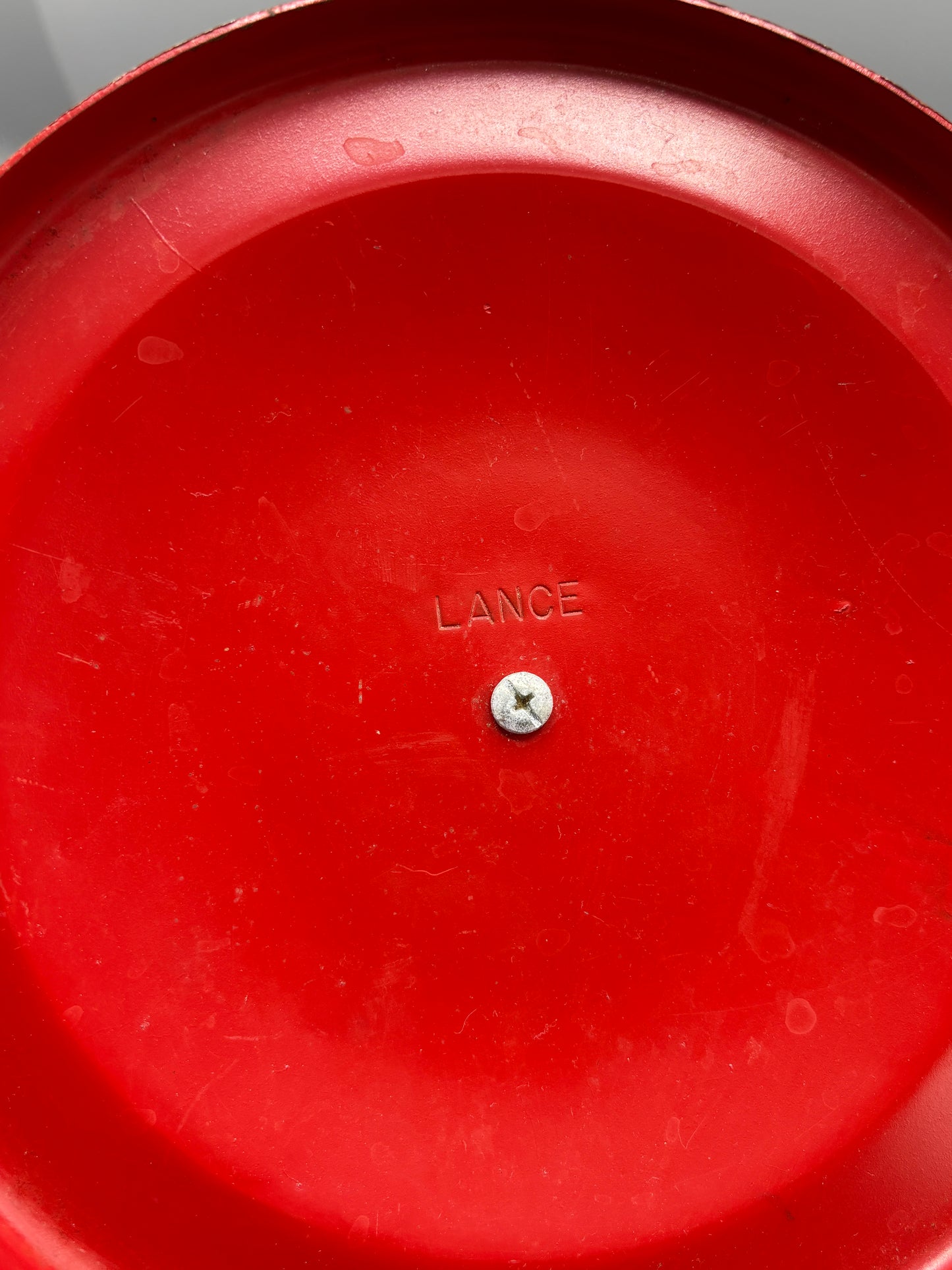 Vintage glass Lance Cracker jar with red metal lid