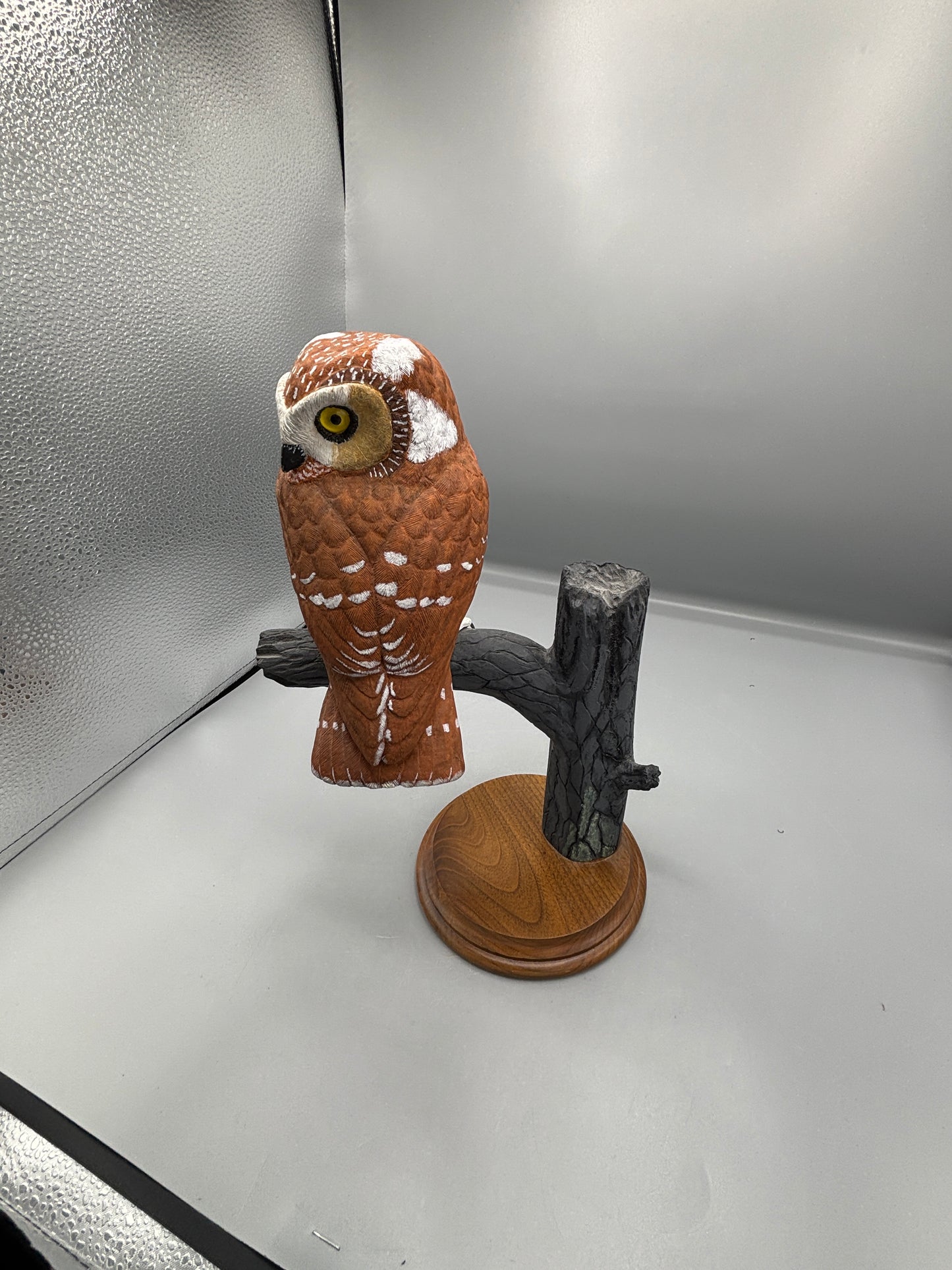 Wooden hand carved Saw Whet Owl on perch