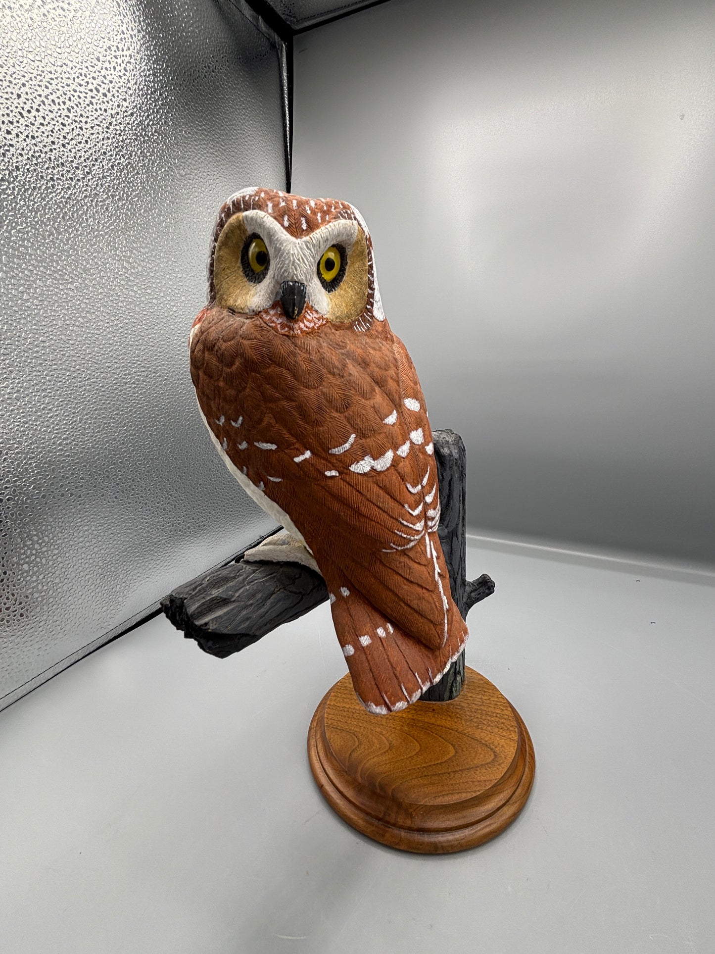 Wooden hand carved Saw Whet Owl on perch