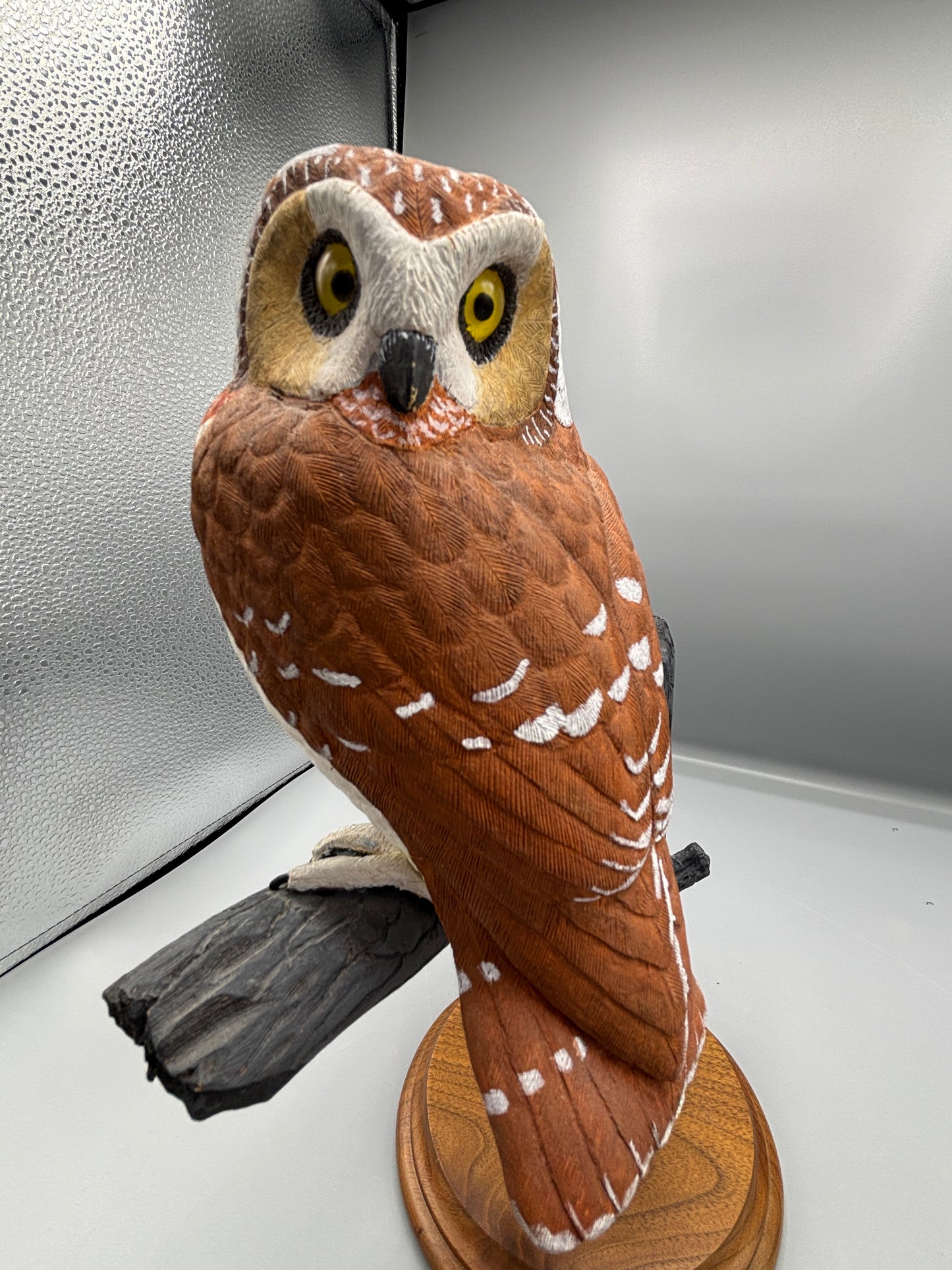 Wooden hand carved Saw Whet Owl on perch